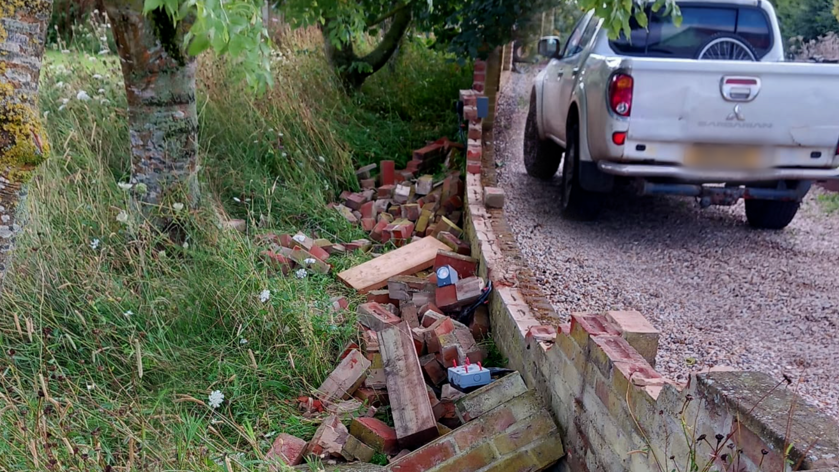 A partially demolished garden wall.