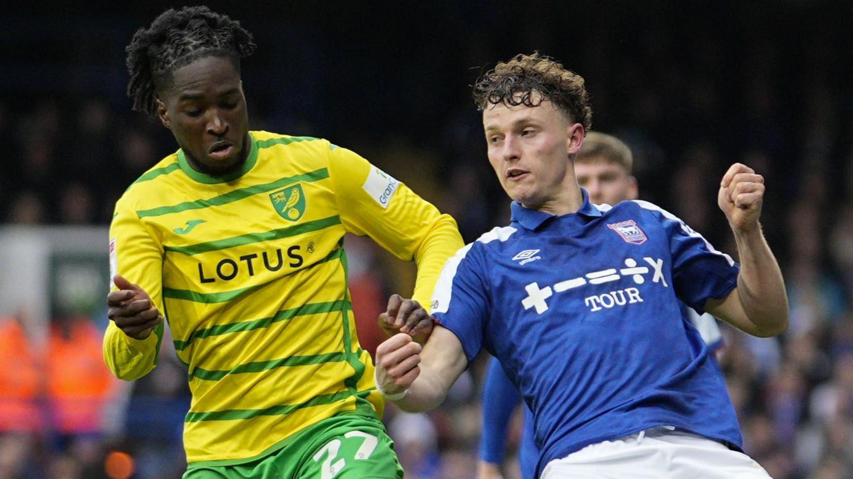Jonathan Rowe (left) and Nathan Broadhead compete for the ball during a 2-2 draw between Ipswich Town and Norwich City in December 2023