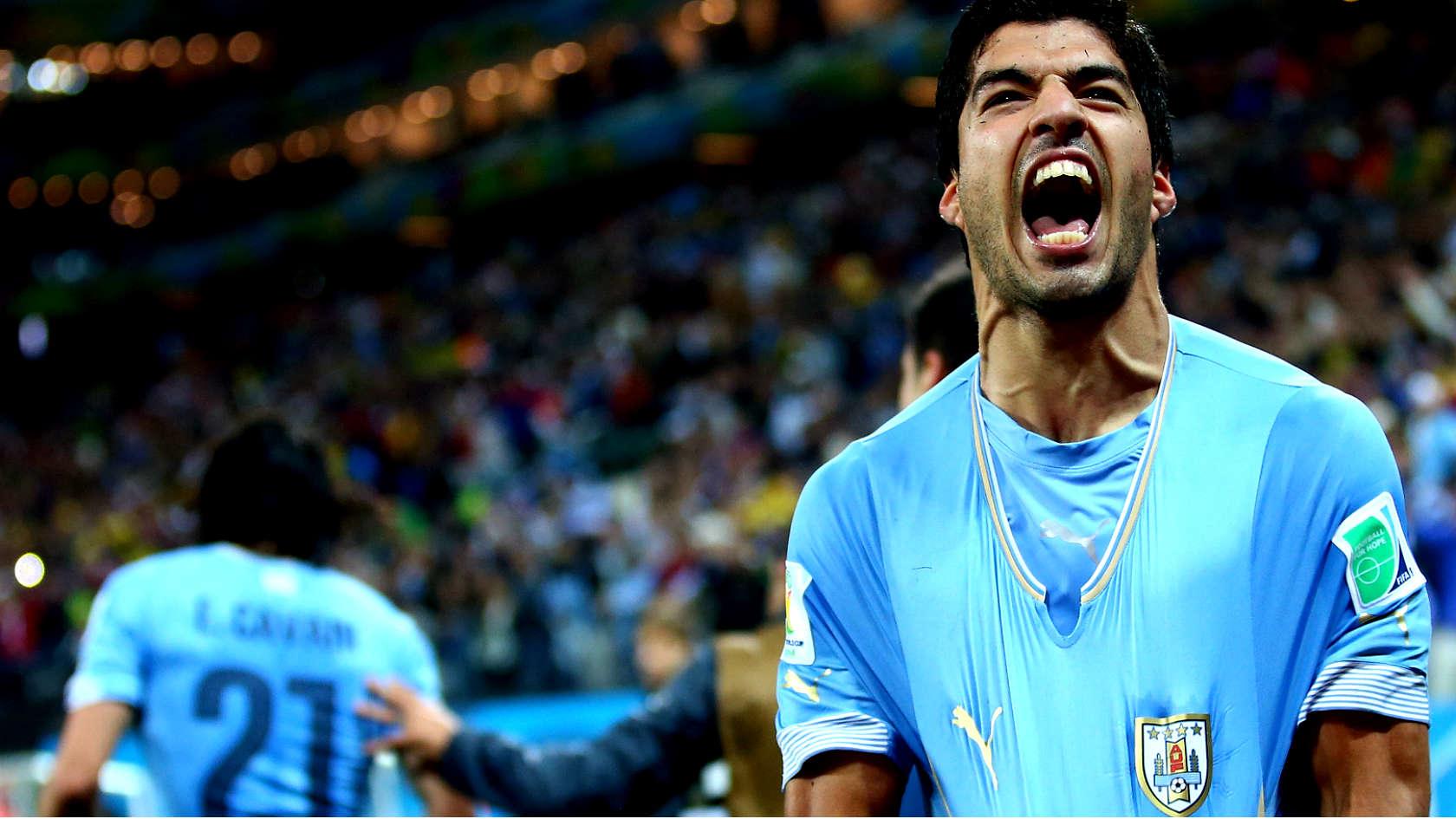 Luis Suarez celebrates his second goal