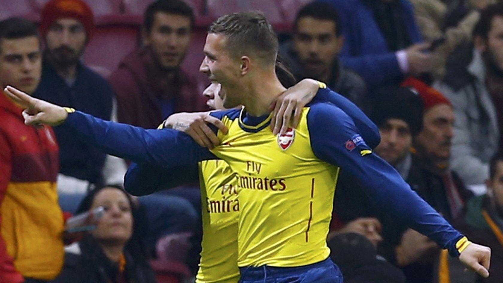 Arsenal celebrate Lukas Podolski's opener