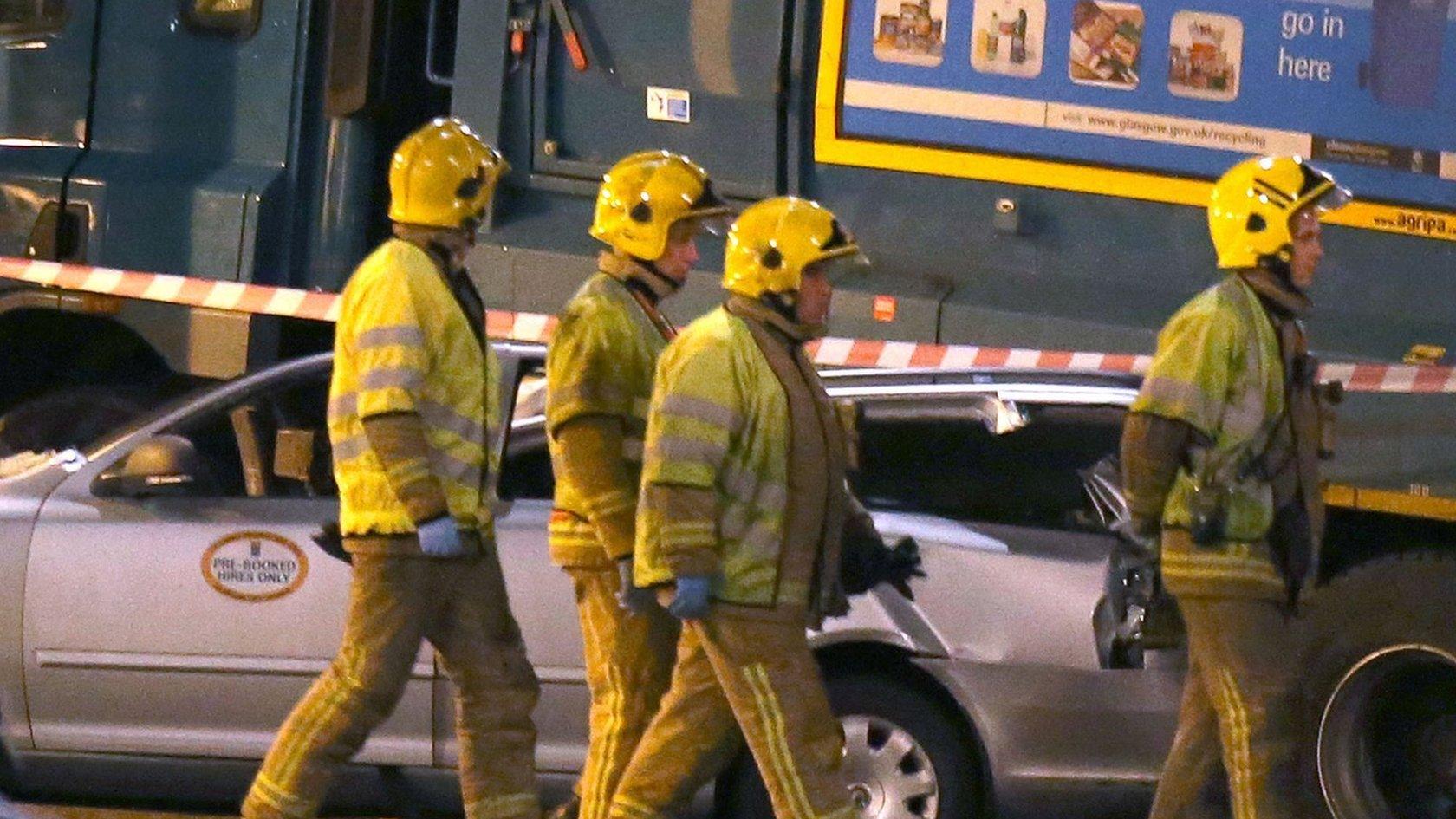 Firefighters at the scene of the fatal crash in George Square, Glasgow