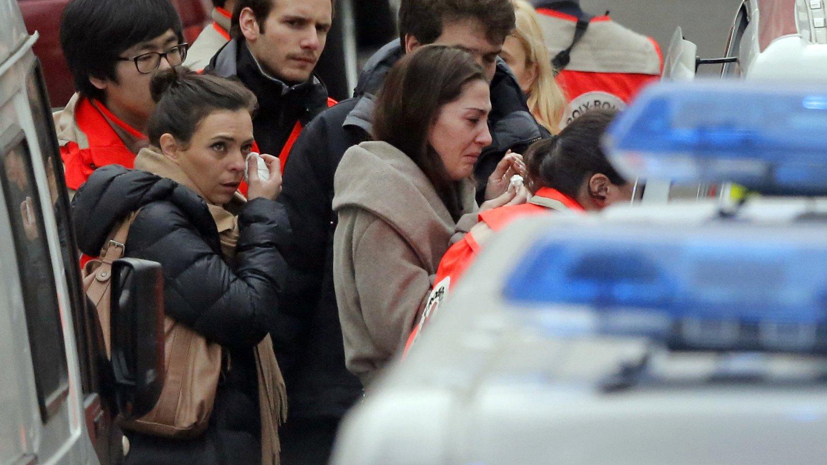 People being evacuated from the Charlie Hebdo offices