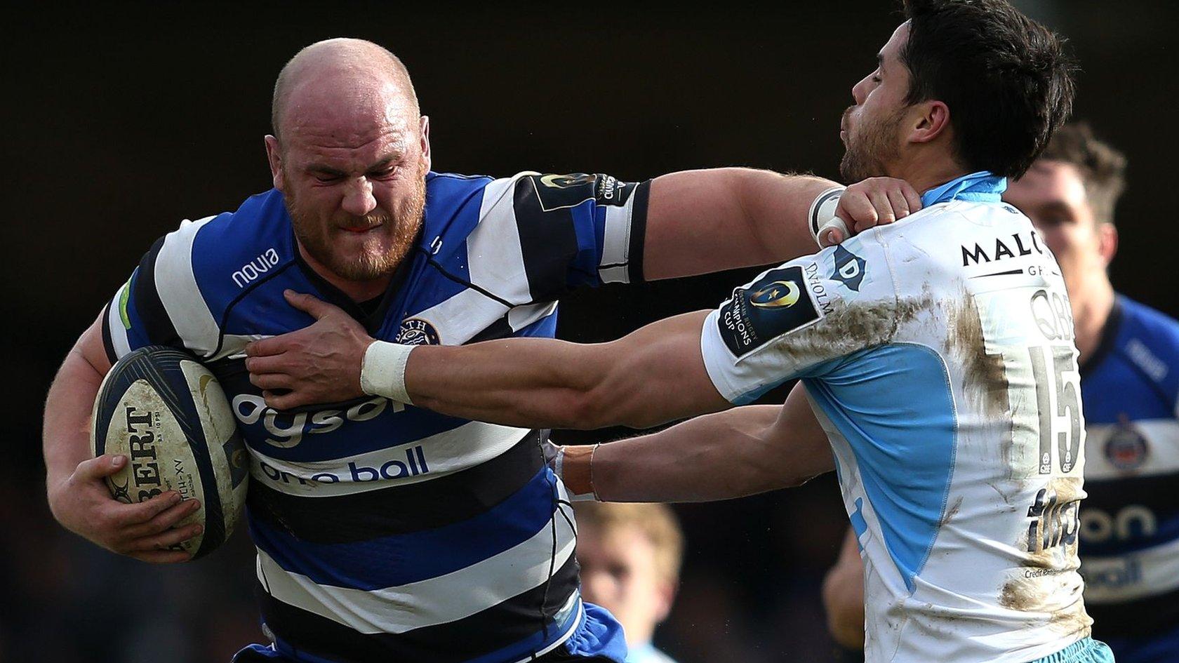 Bath blind-side flanker Matt Garvey hands off Glasgow full-back Sean Maitland