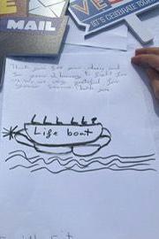 A letter sent from a child to a veteran, including a drawing of a lifeboat