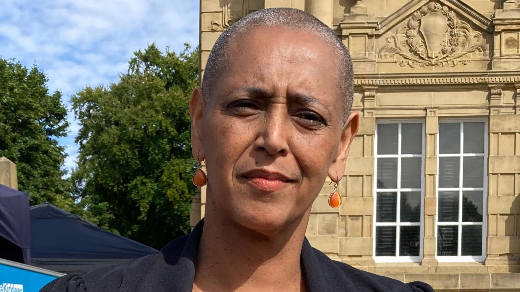 West Yorkshire deputy mayor Alison Lowe, pictured in front of what appears to be a large Georgian mansion behind.