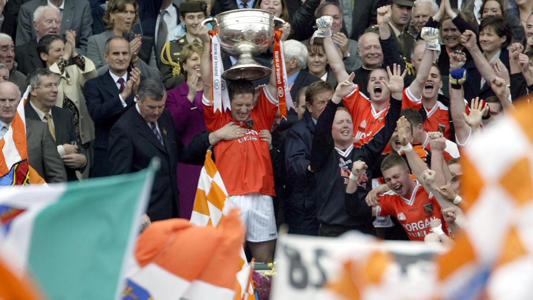 Current Armagh manager Kieran McGeeney lifts Sam Maguire 22 years ago