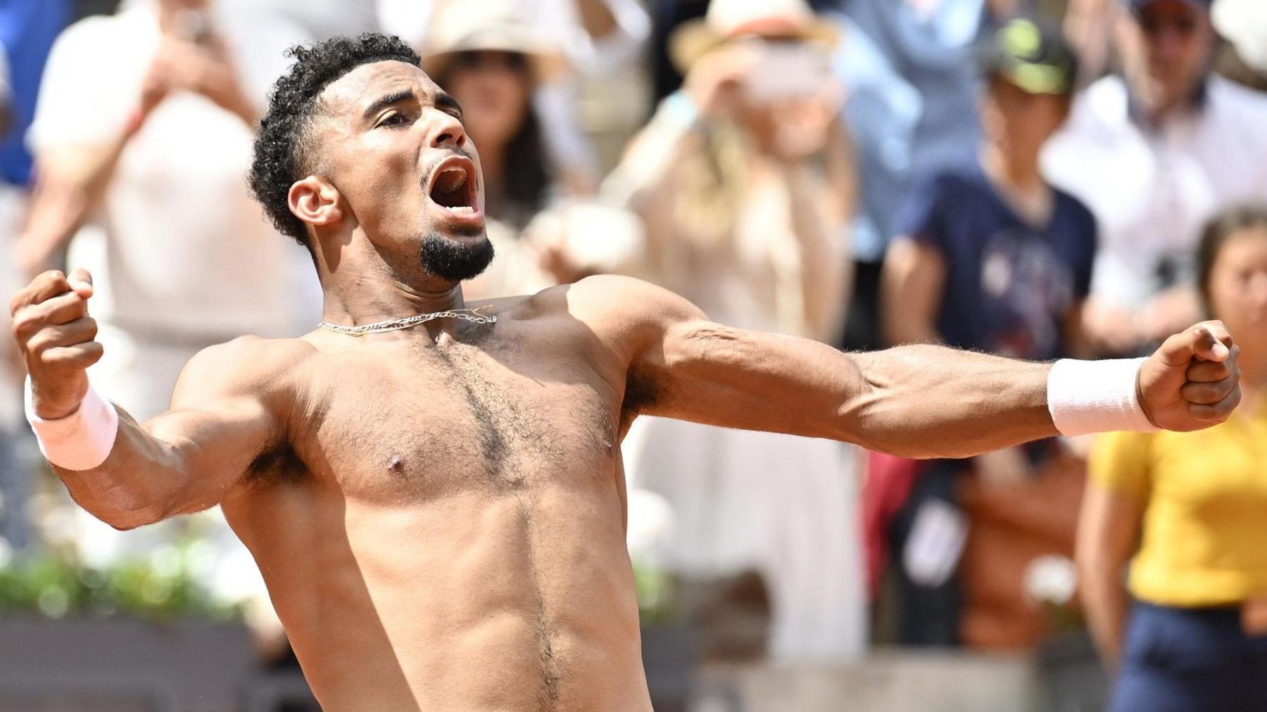 Arthur Fils celebrates after winning his French Open second-round match