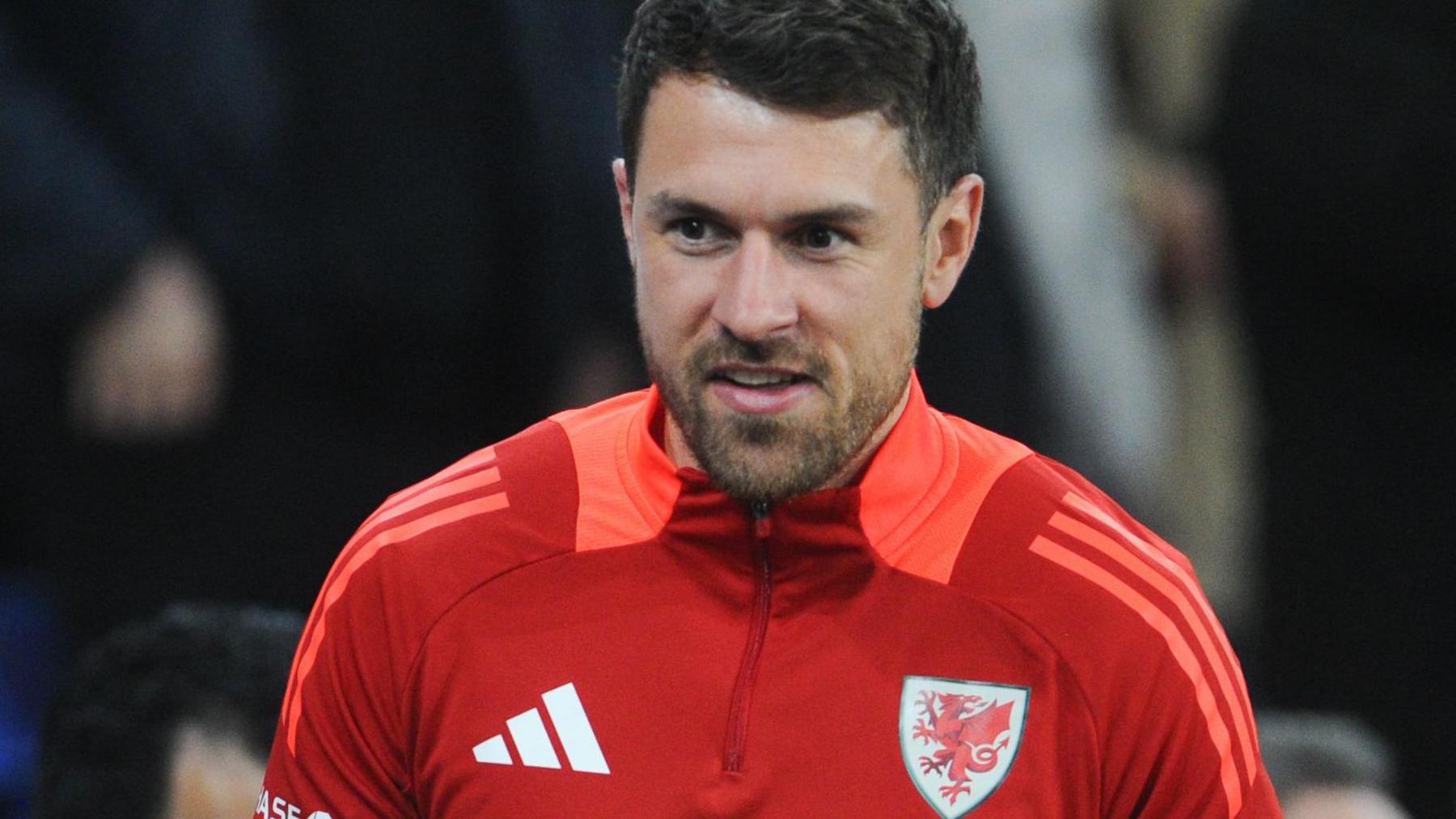 Aaron Ramsey watches a Wales game from the stands