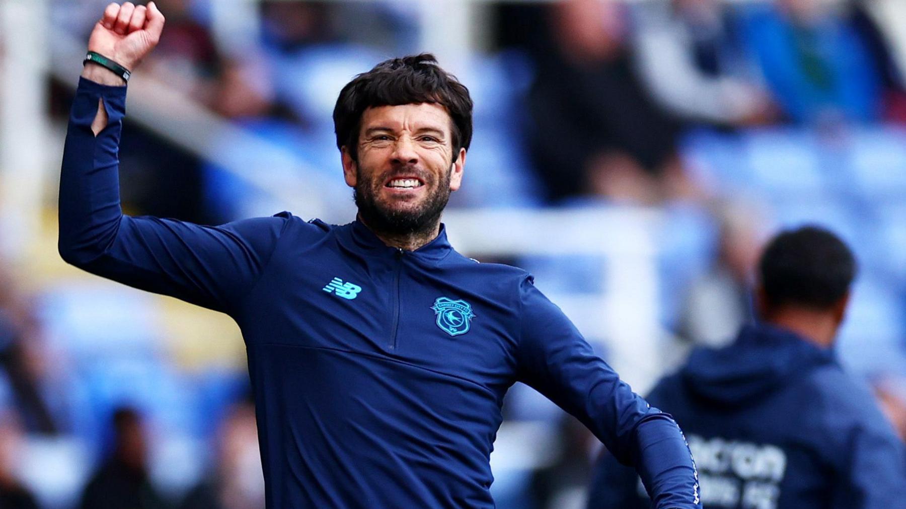 Cardiff City manager Brian Barry-Murphy punches the air in delight as he celebrates leading the Bluebirds back to the Championship.