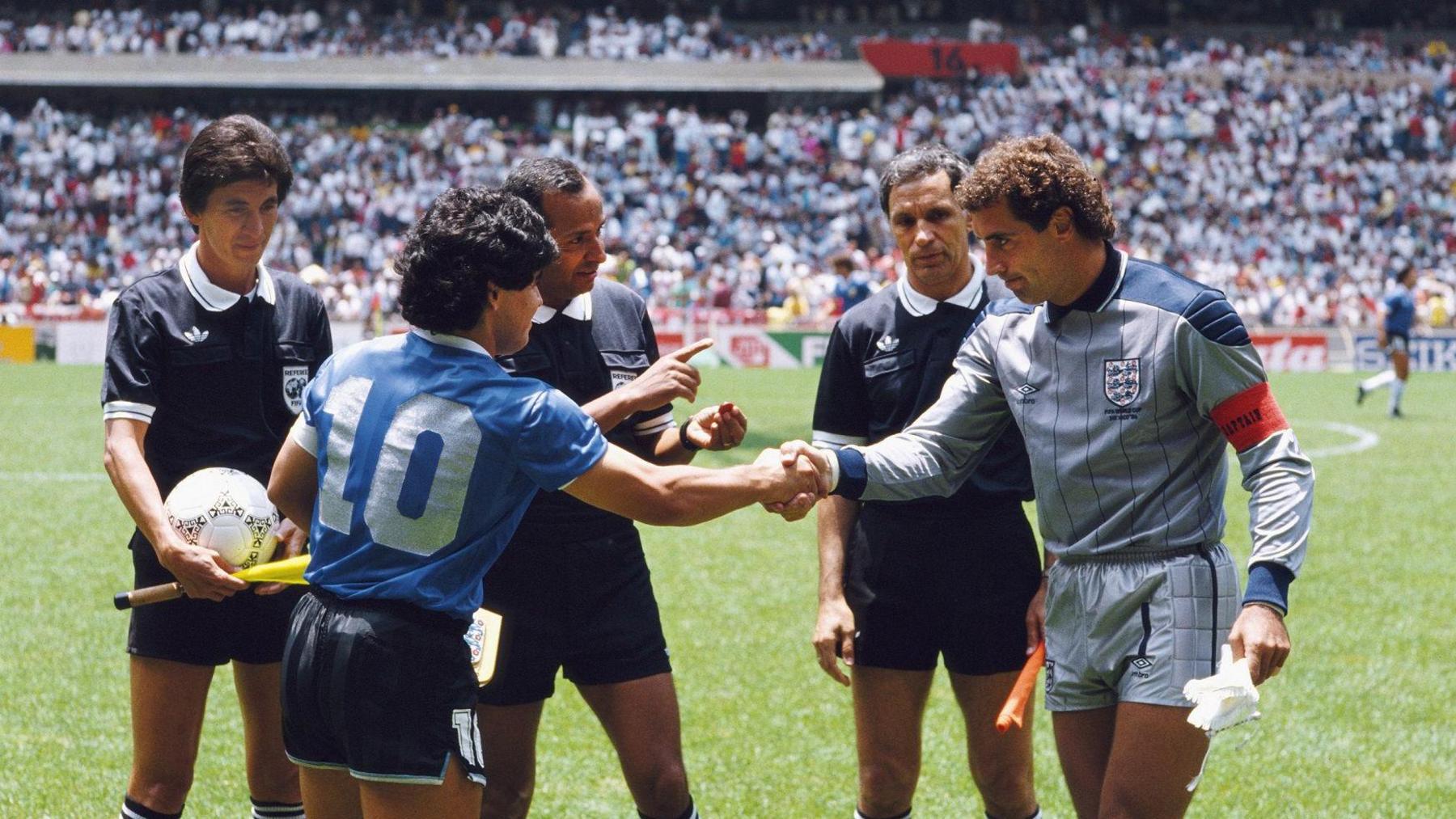 Diego Maradona of Argentina (left) shakes hands with Peter Shilton of England ahead of the 1986 World Cup quarter-final. Referee Ali Bin Nasser is standing behind them along with two linesmen