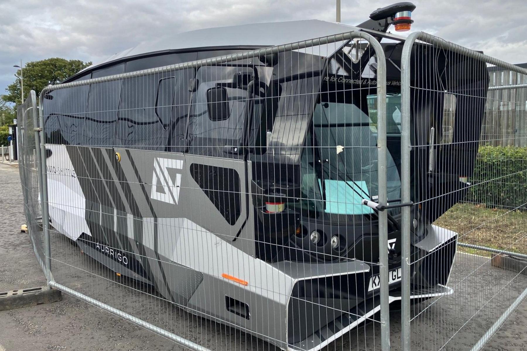 Auto-Shuttle driverless bus at Inverness Campus behind fencing