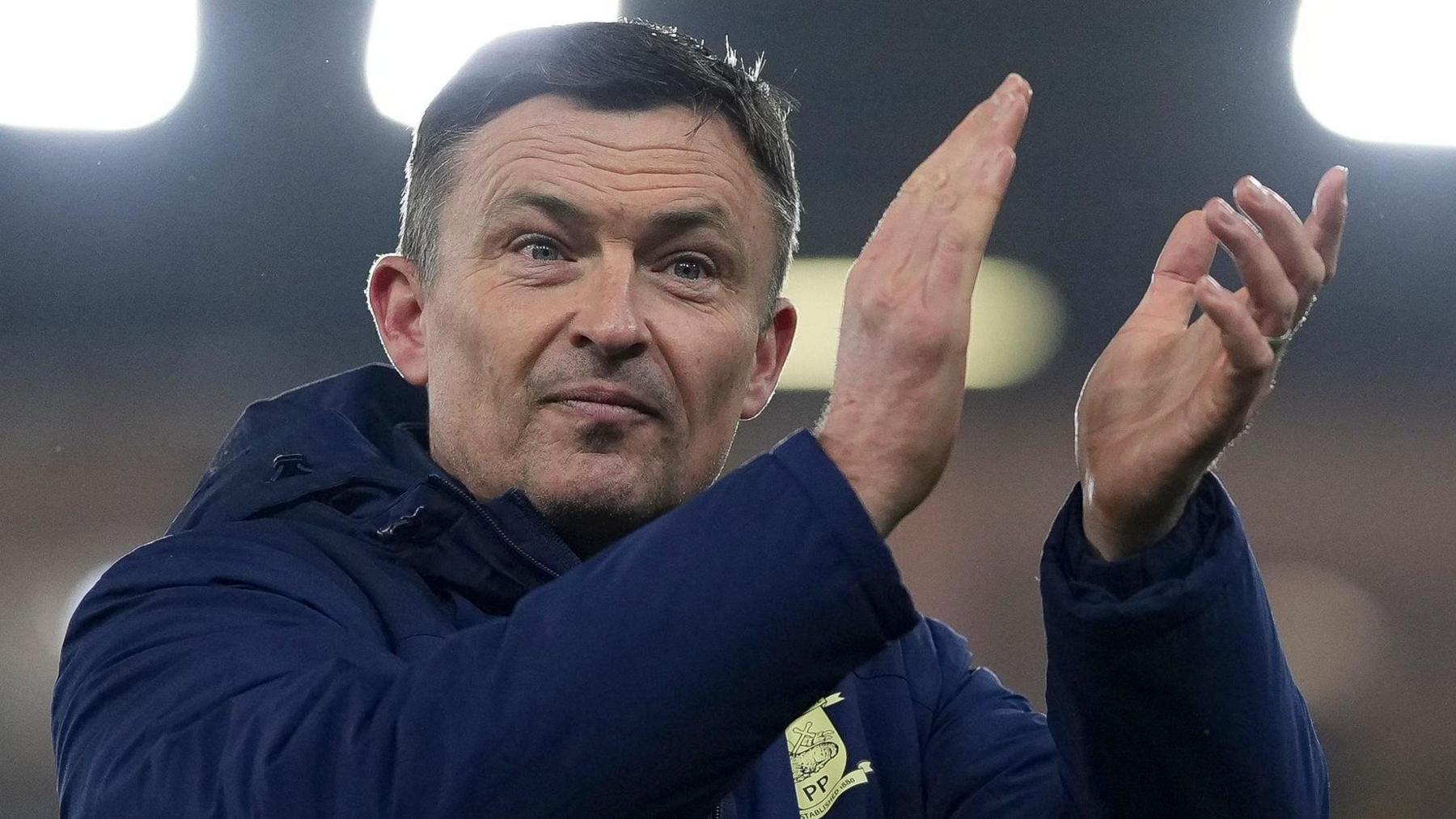 Preston boss Paul Heckingbottom clapping the fans after the match