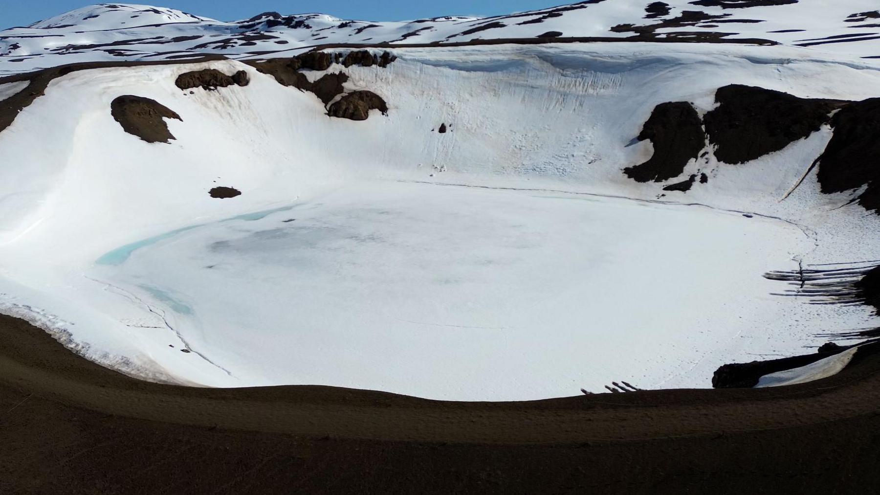 Snow and ice covers the crater lake at Krafla volcano