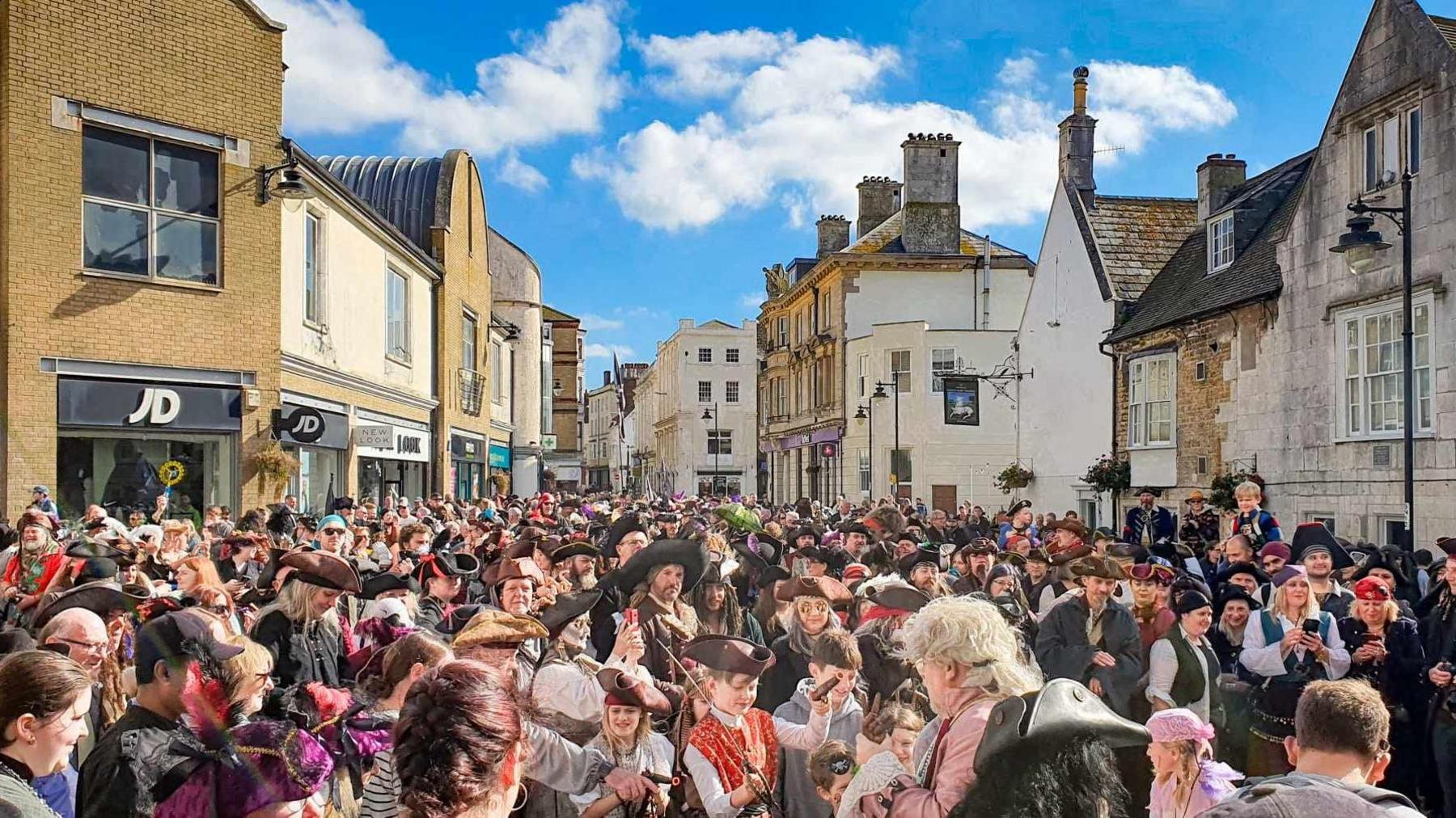 Hundreds of people dressed as pirates in Weymouth's Millennium Square