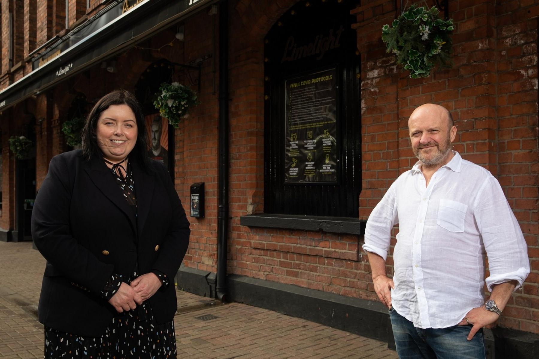 Communities Minister Deirdre Hargey is pictured with Alan Simms during a visit to The Limelight in Belfast, a live music venue.