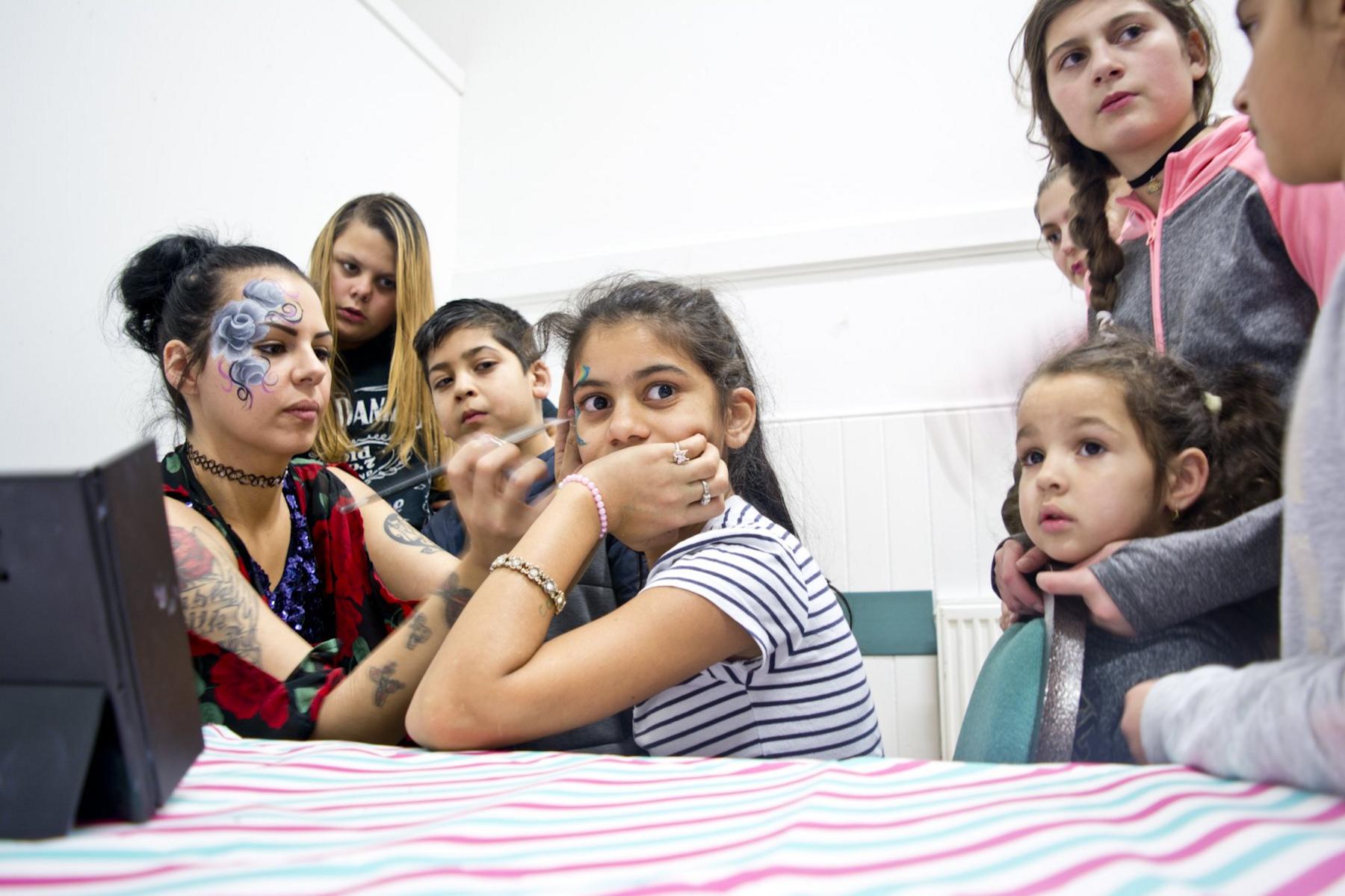 face painting at Roma family celebration
