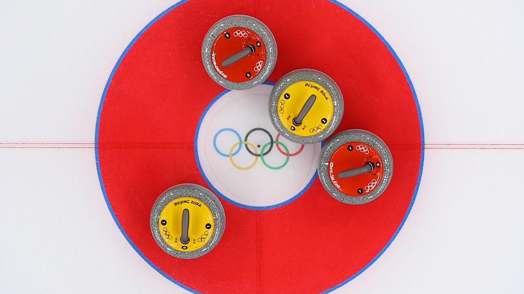 Curling stones in the target