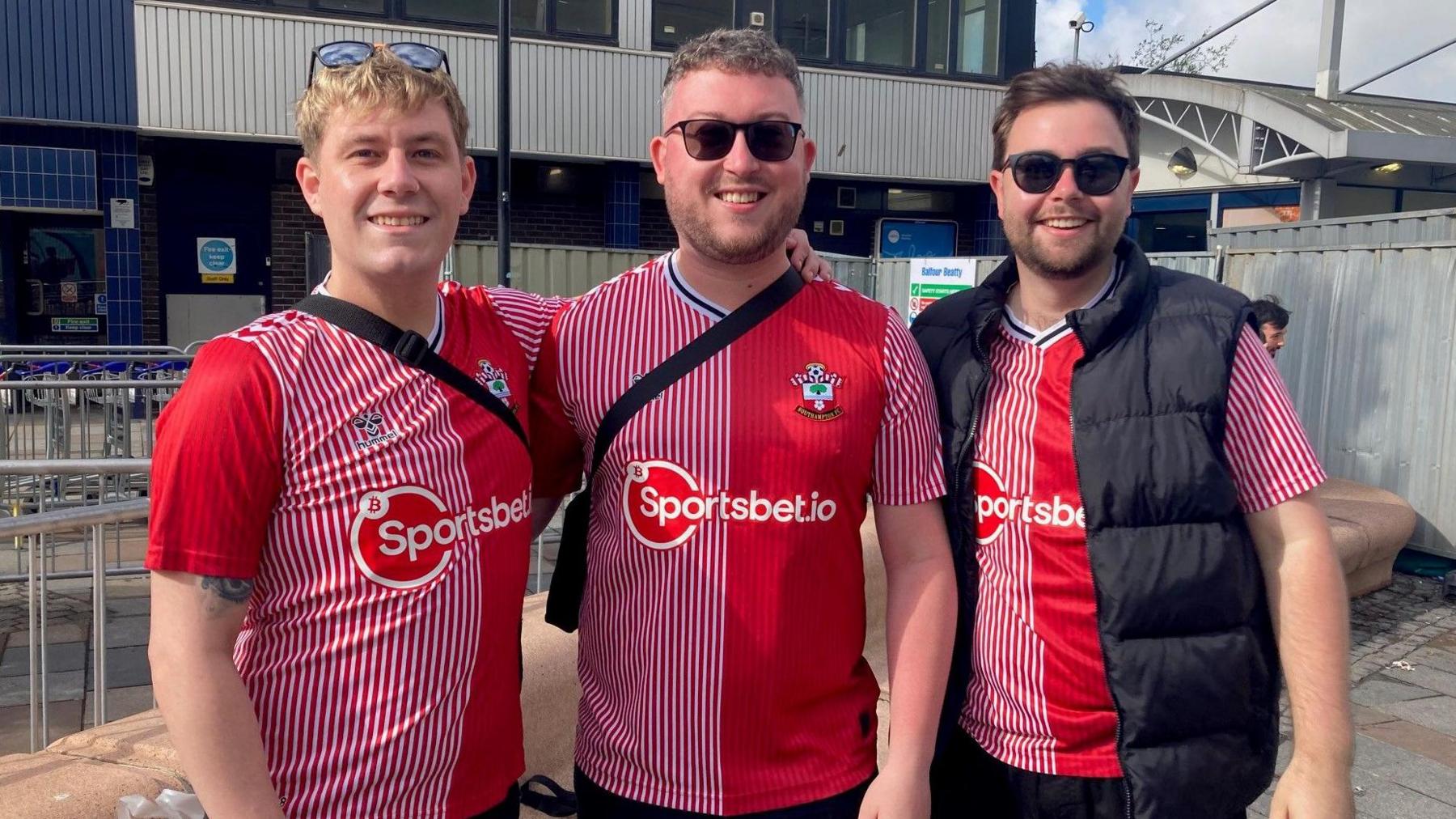 Saints supporters Jamie, Shane and Jordan