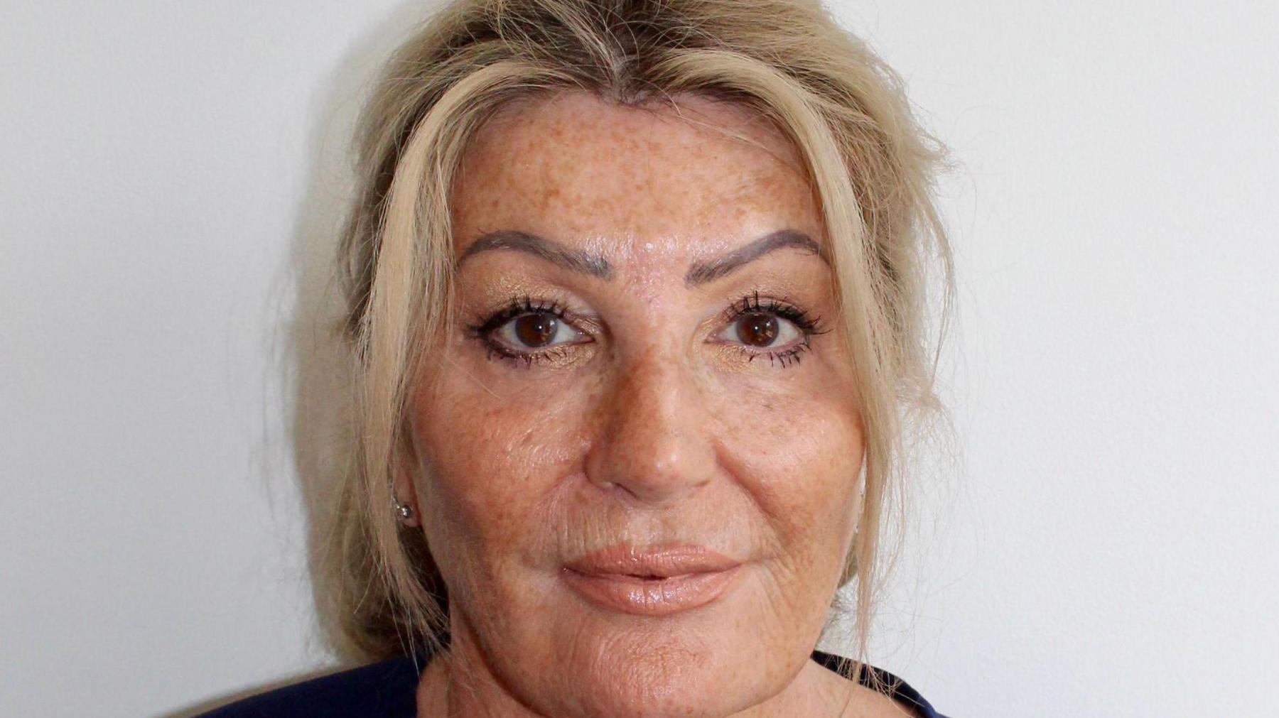 A close-up image of a woman, Barbara Pointon, who has blonde hair and is wearing a black top.