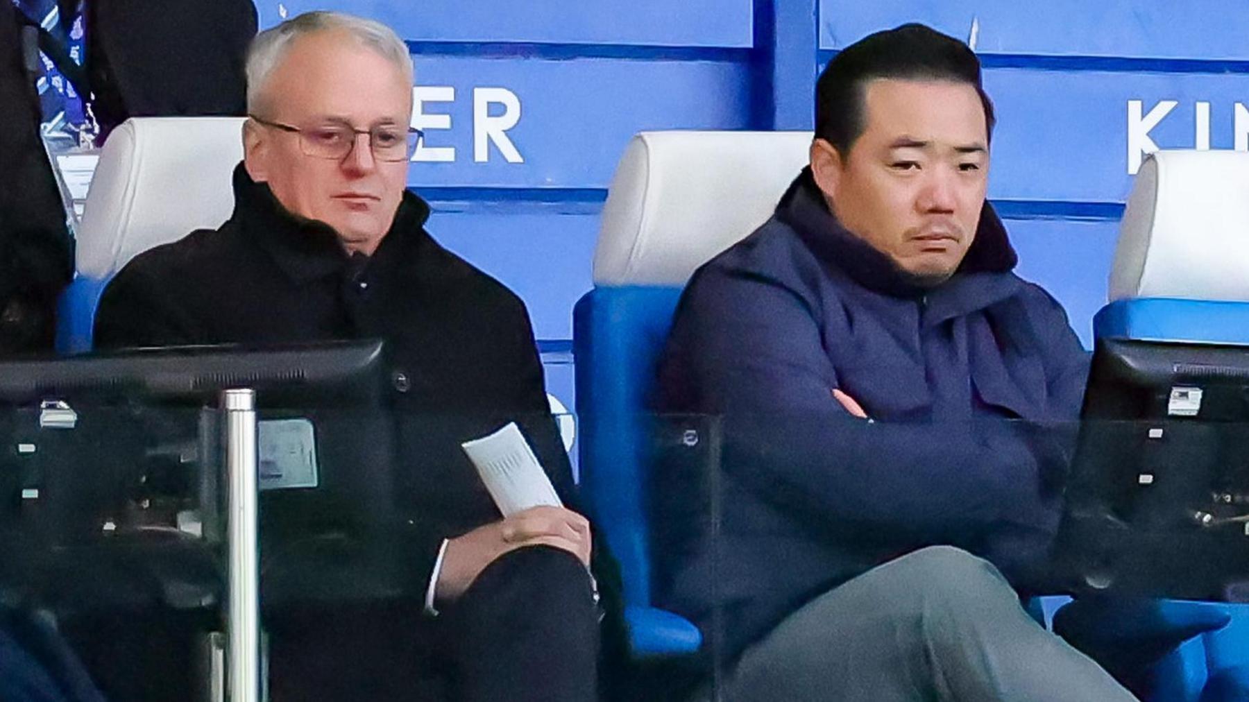 Leicester director of football Jon Rudkin sitting next to owner Khun Aiyawatt 'Top' Srivaddhanaprabha