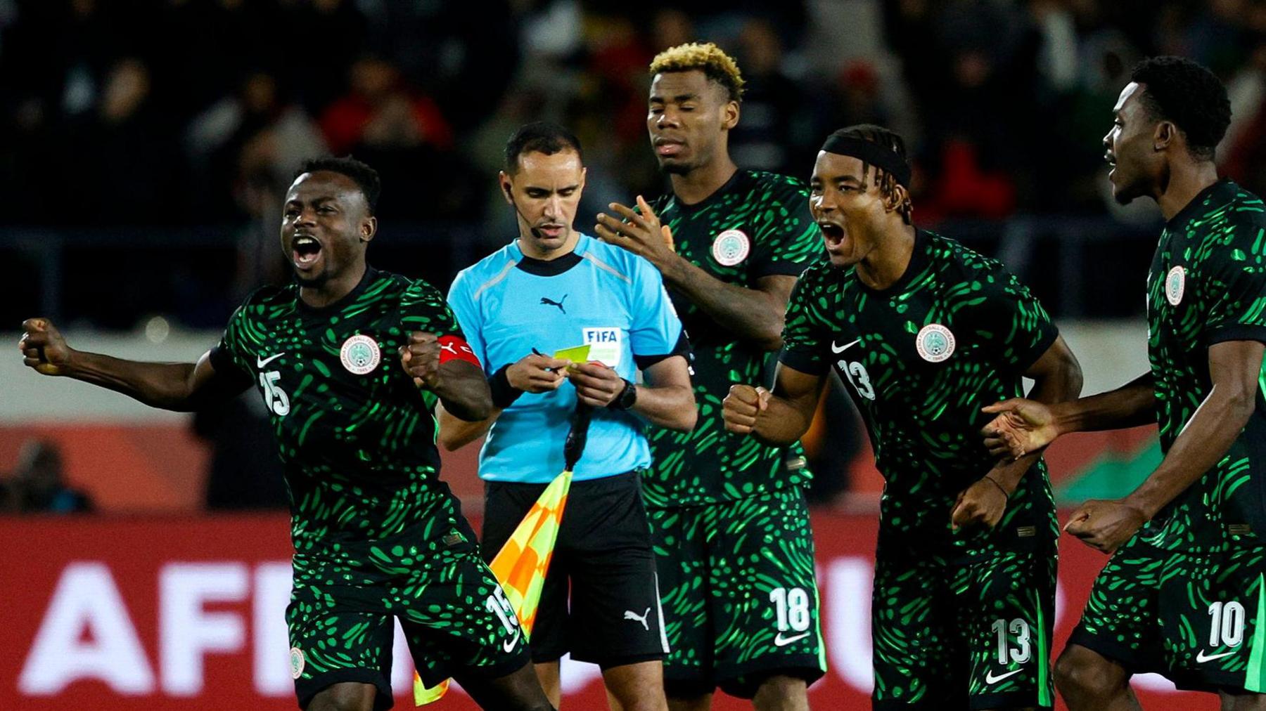 Nigeria players celebrate beating Egypt on penalties