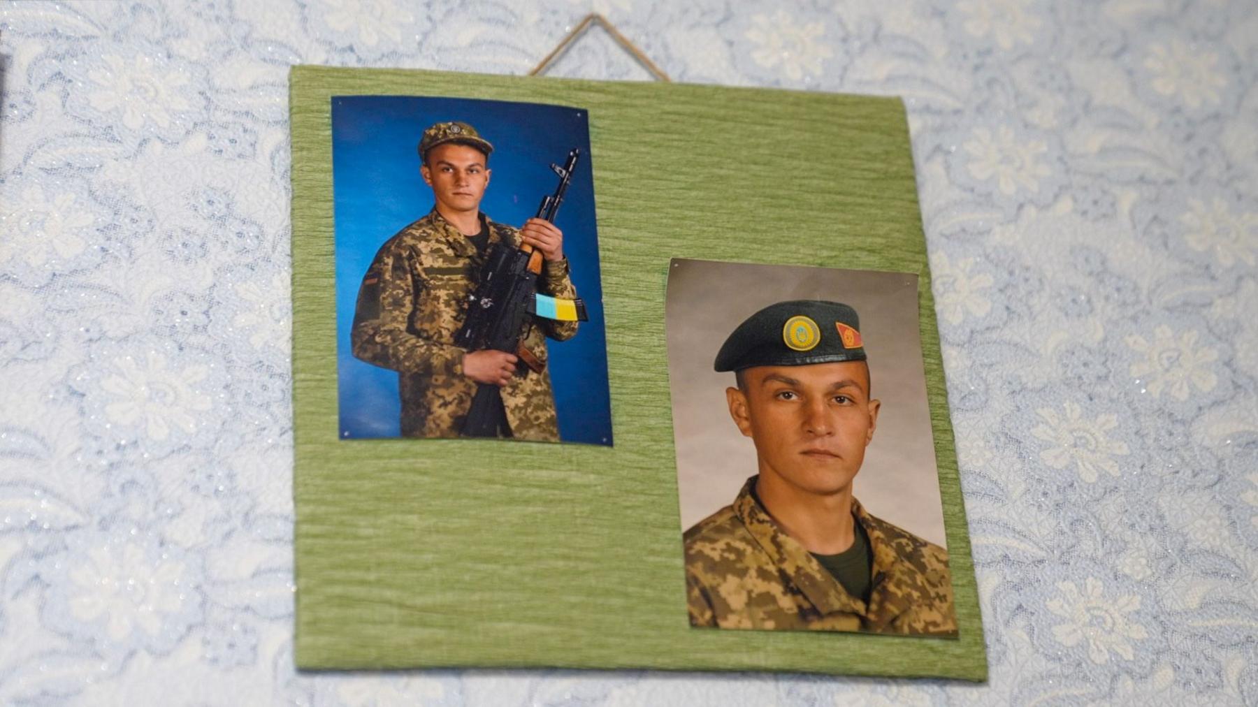 Two photos of Lera's brother in uniform hang on the wall