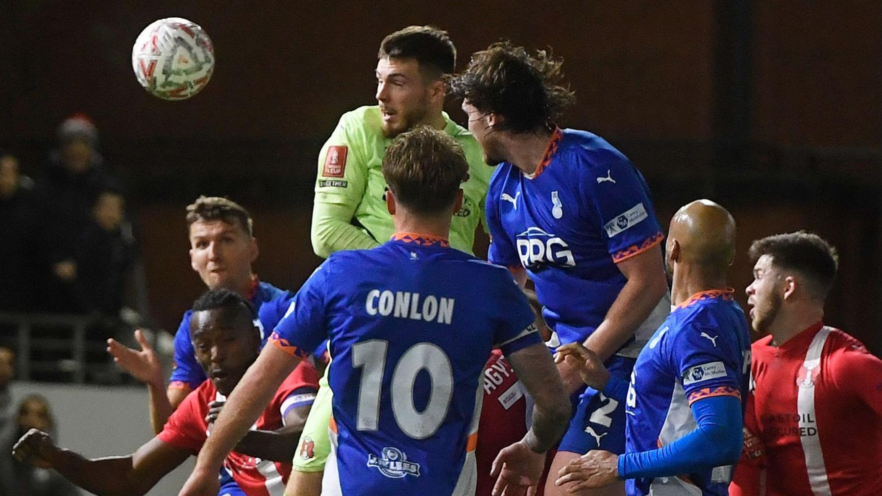 Goalkeeper Josh Keeley heads in Leyton Orient's equalising goal in stoppage time against Oldham Athletic 