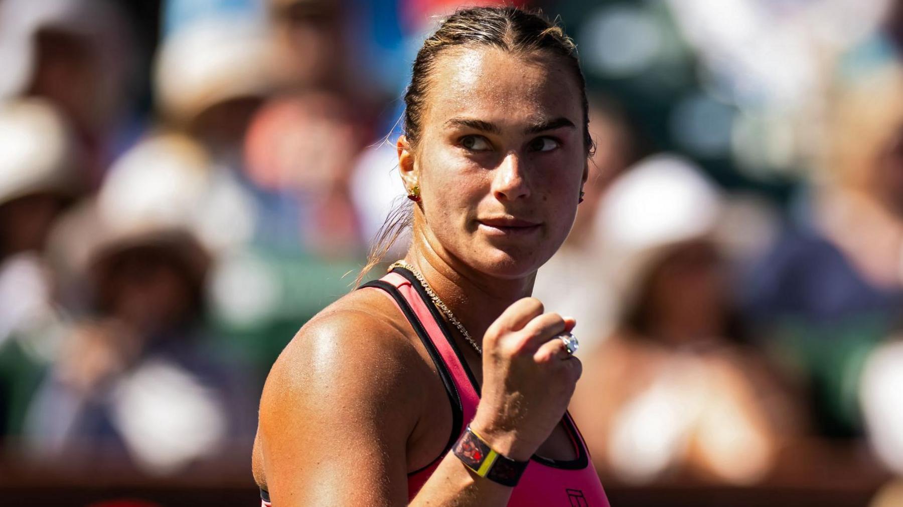 Aryna Sabalenka celebrates after beating Victoria Mboko