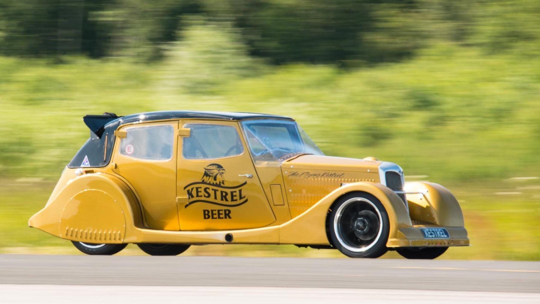 Yellow Riley Kestrel with "Kestrel Beer" logo on side