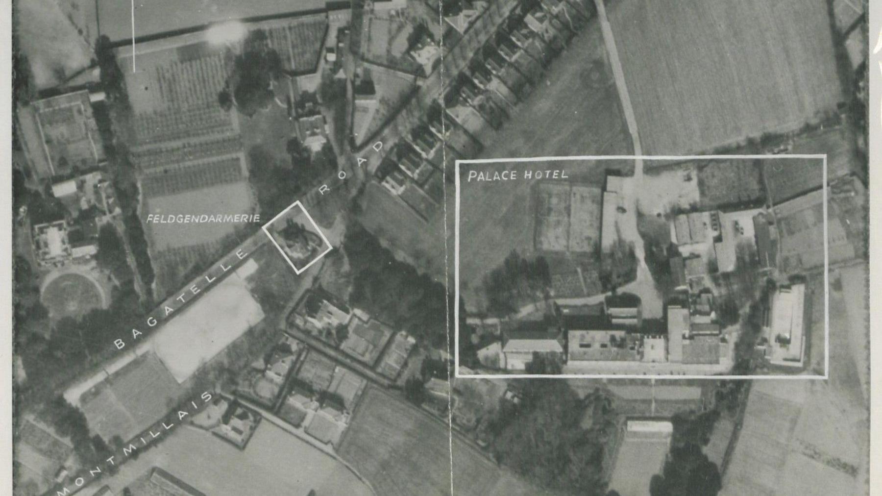 An aerial reconnaisance black and white photo of a number of buildings including the Palace Hotel.