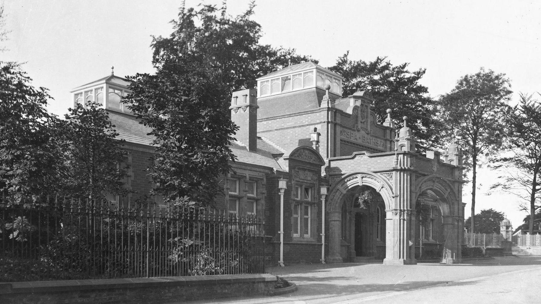 A historic black and white image of an ornate Edwardian building