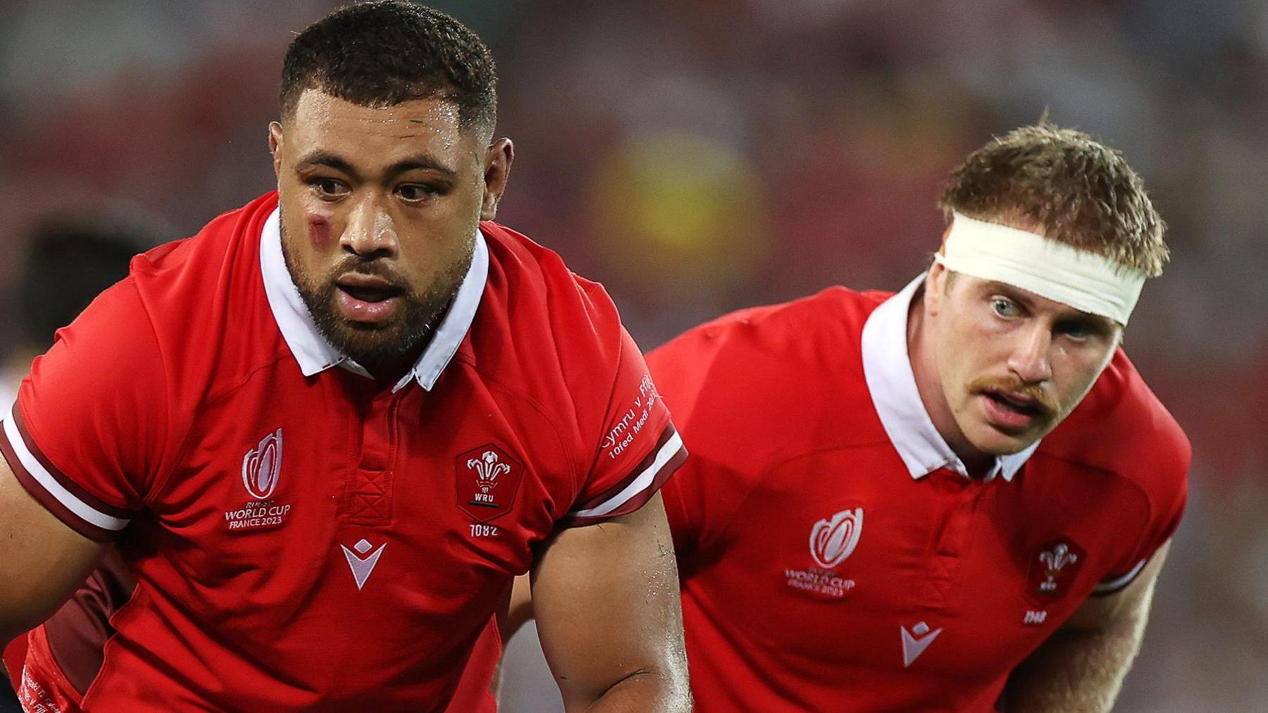 Taulupe Faletau and Aaron Wainwright in action for Wales