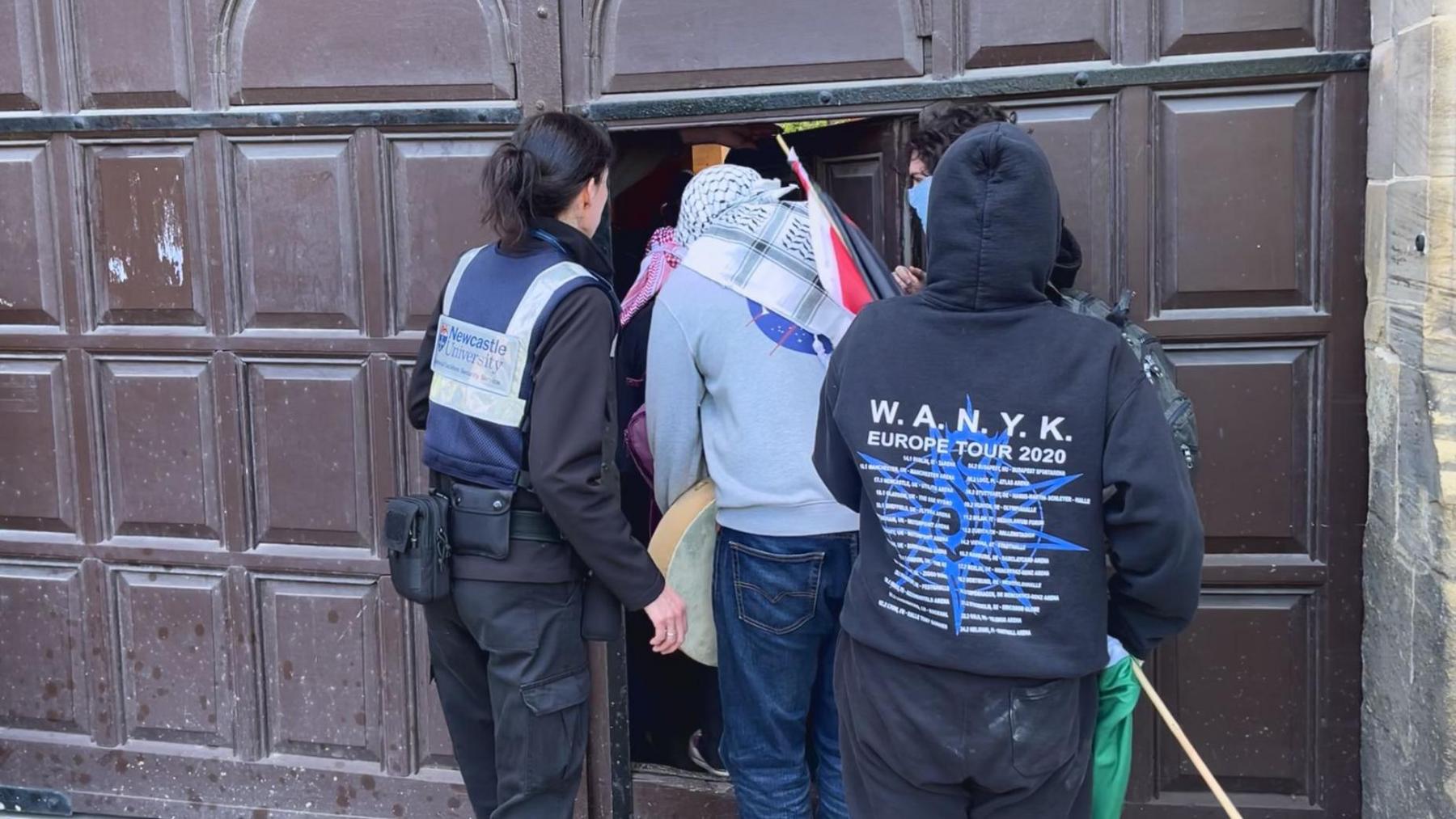 Protesters entering the building