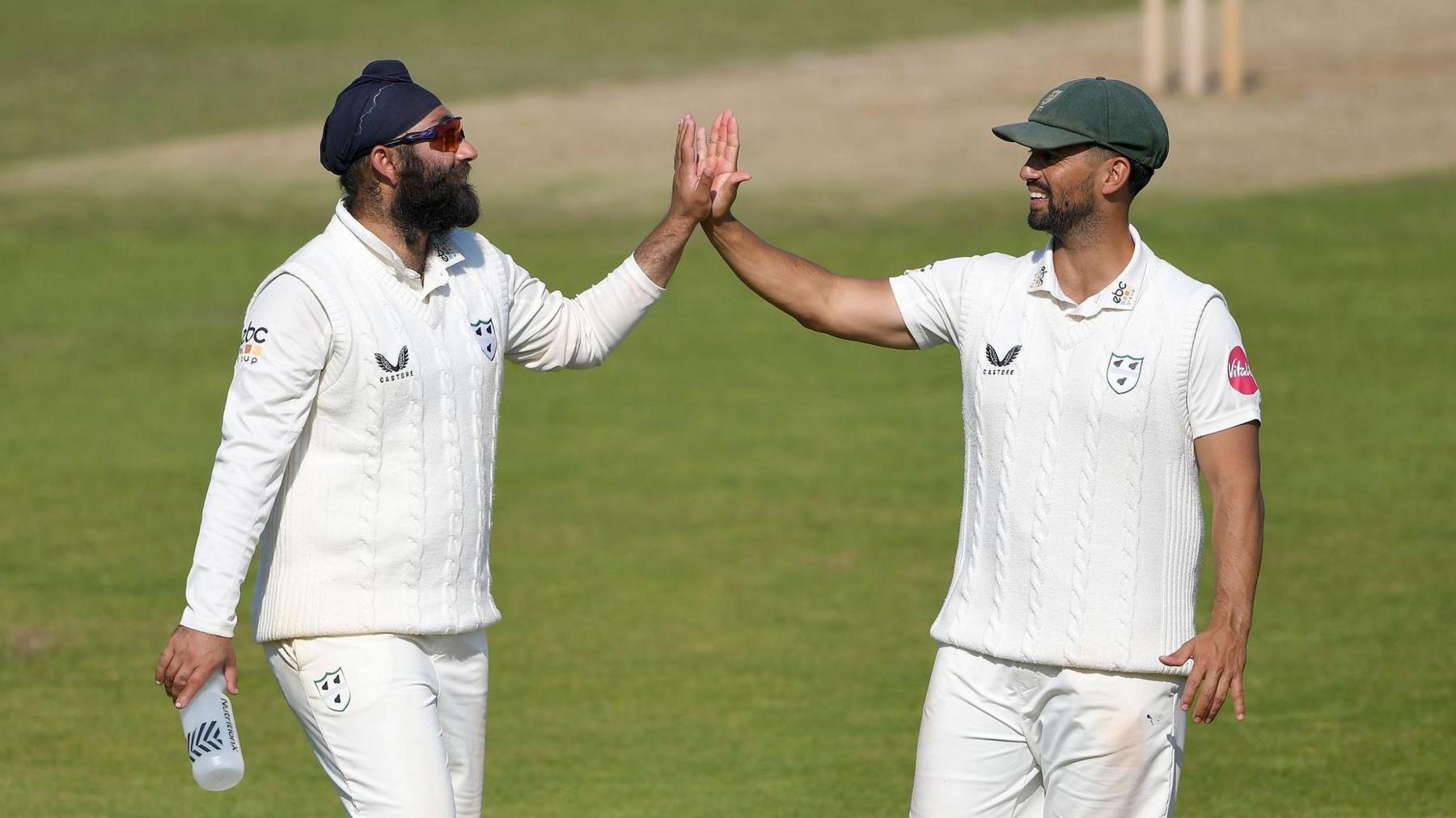 Amar Virdi (left) and Worcestershire skipper Brett D'Oliveira in action during a cricket match.