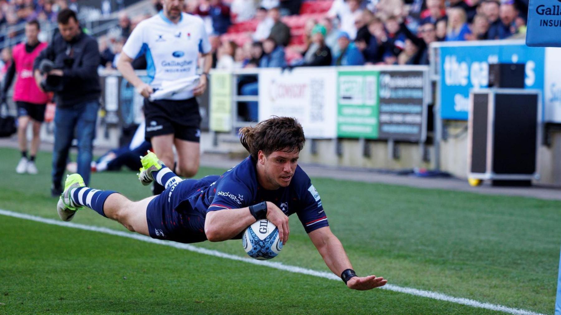 Benhard Janse van Rensburg dives over to score a try for Bristol last season