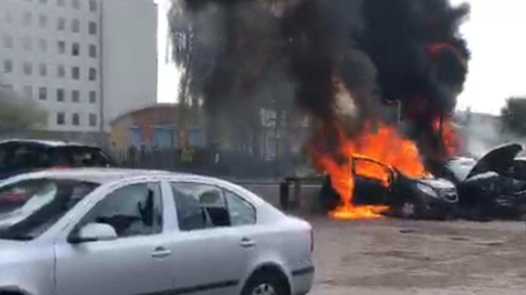 Thick, black smoke rises from a car, filled with flames, in Hull on 3 August 2024.