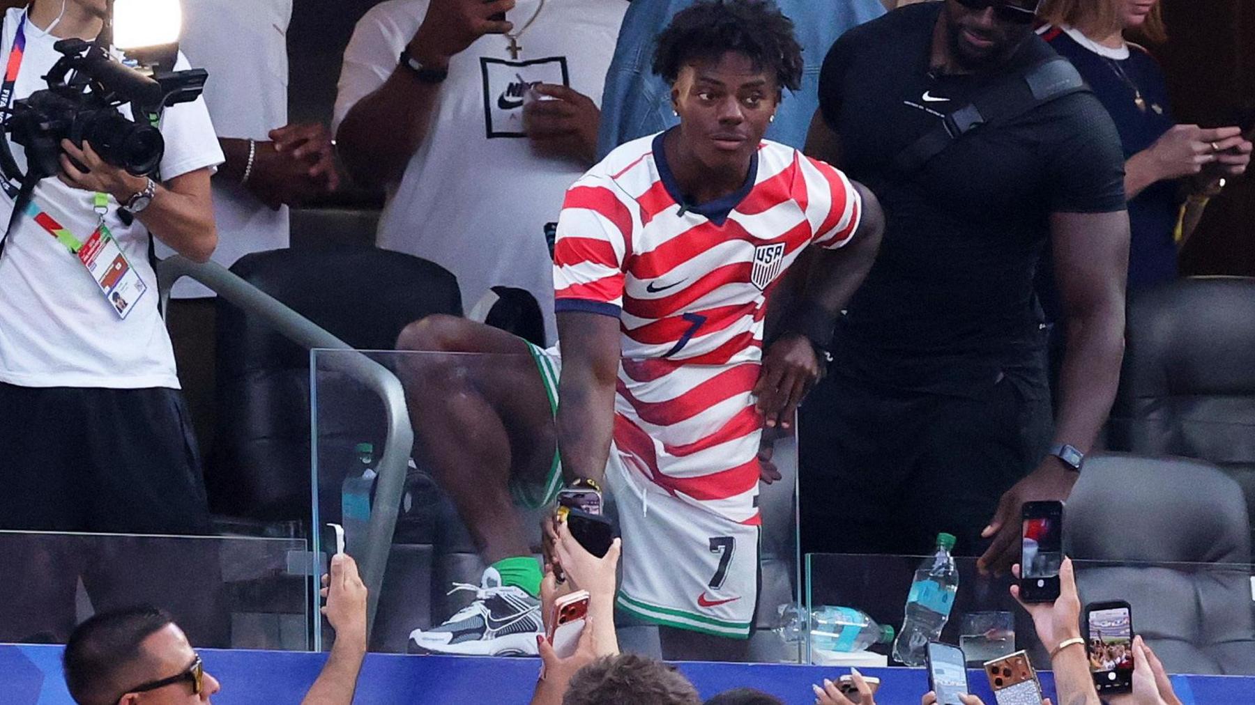 Internet personality IShowSpeed being filmed wearing a USA kit at the Los Angeles Stadium