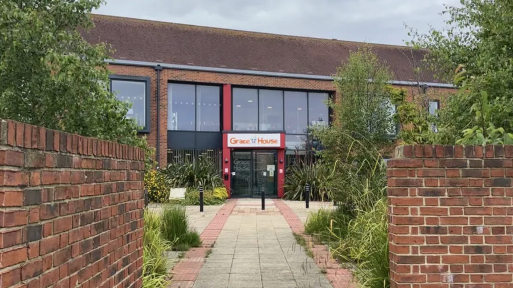 A children's respite care building, which has large windows and a sign saying Grace House.