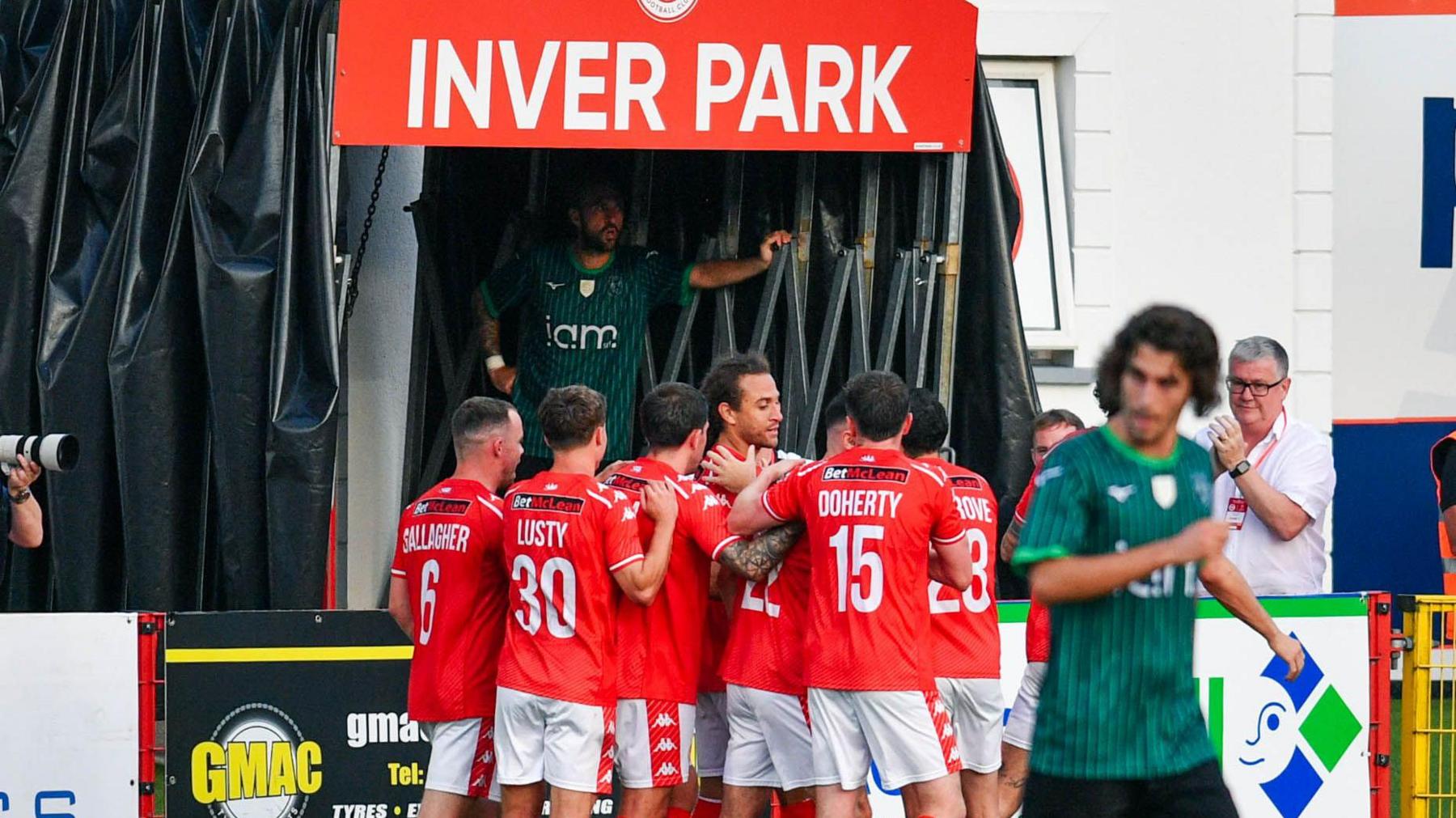 Larne celebrate Dan Bent goal