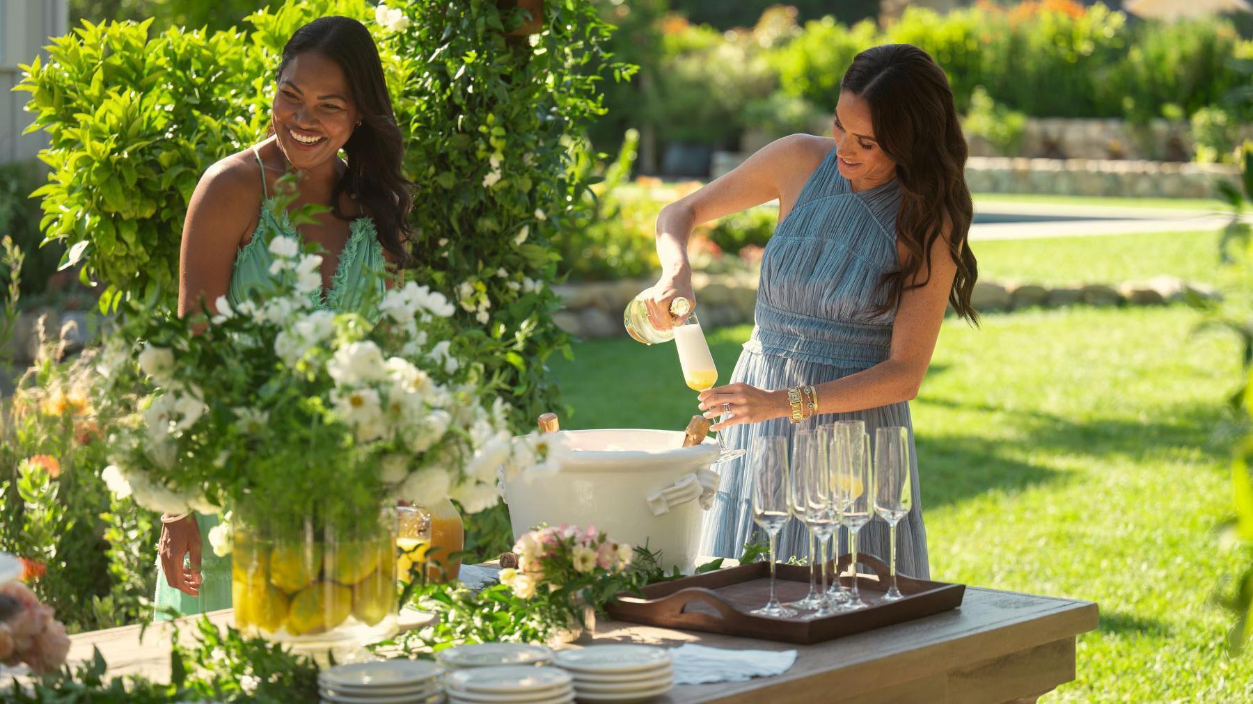 Meghan in the garden pouring drinks in her Netflix series