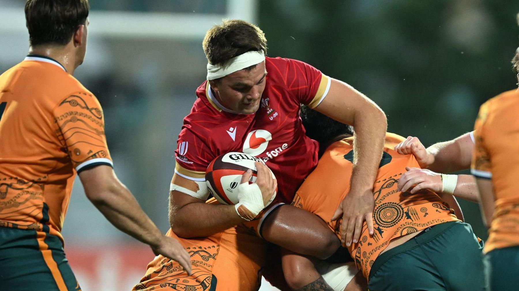 Wales Under-20s captain Deian Gwynne carries the ball into the Australia defence