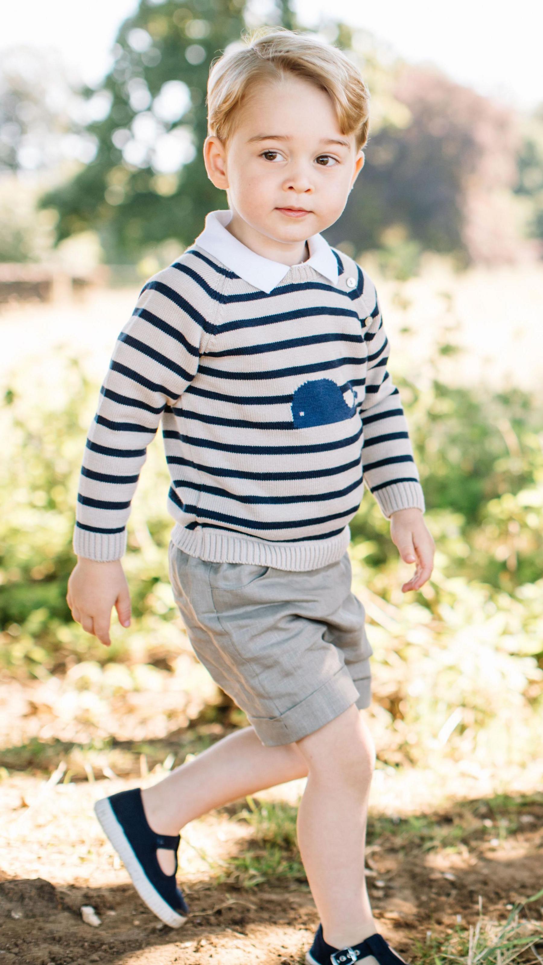 Prince George on his third birthday in a stripey top