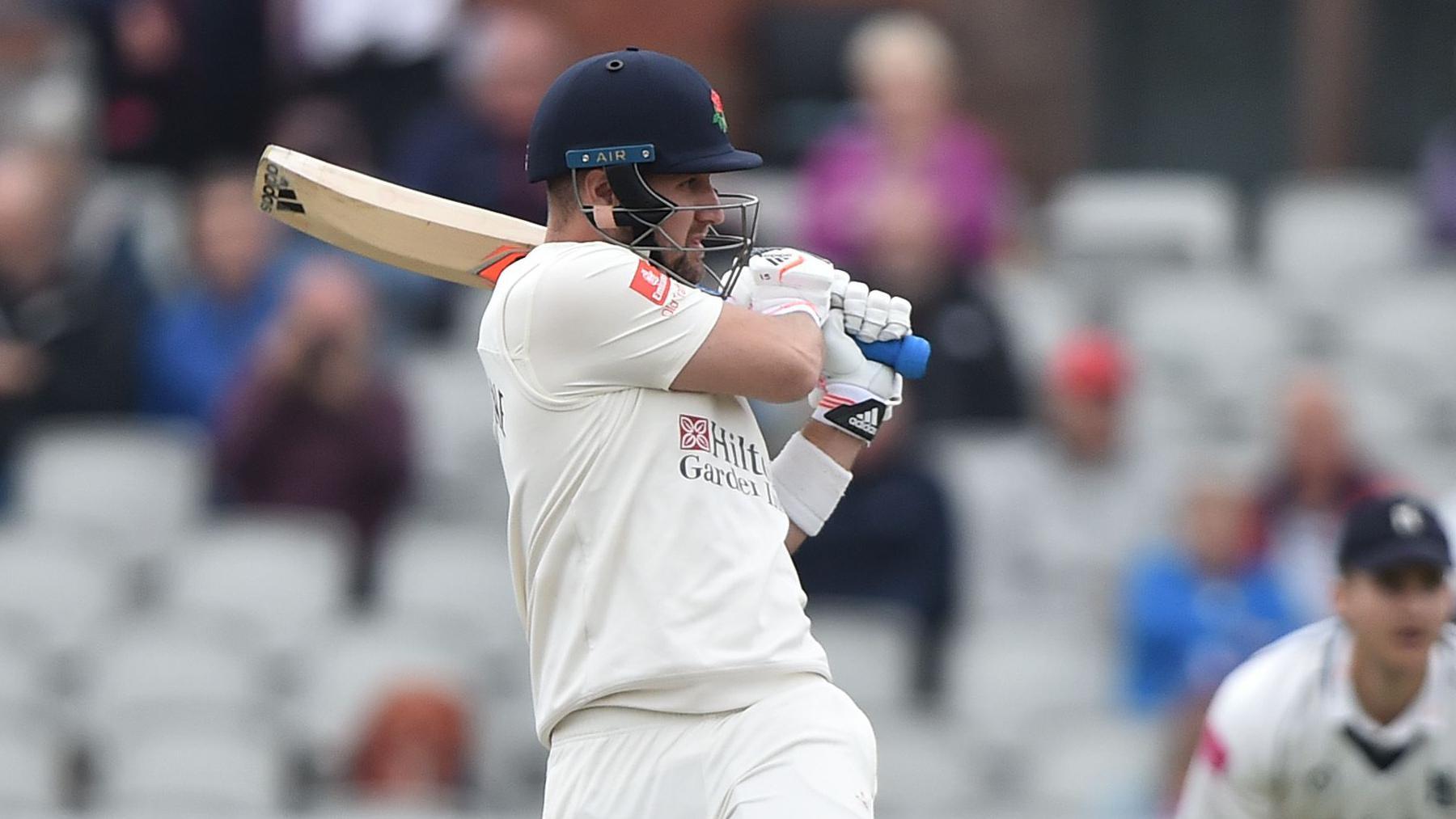 Liam Livingstone playing a hook shot for Lancashire in a Championship match at Old Trafford