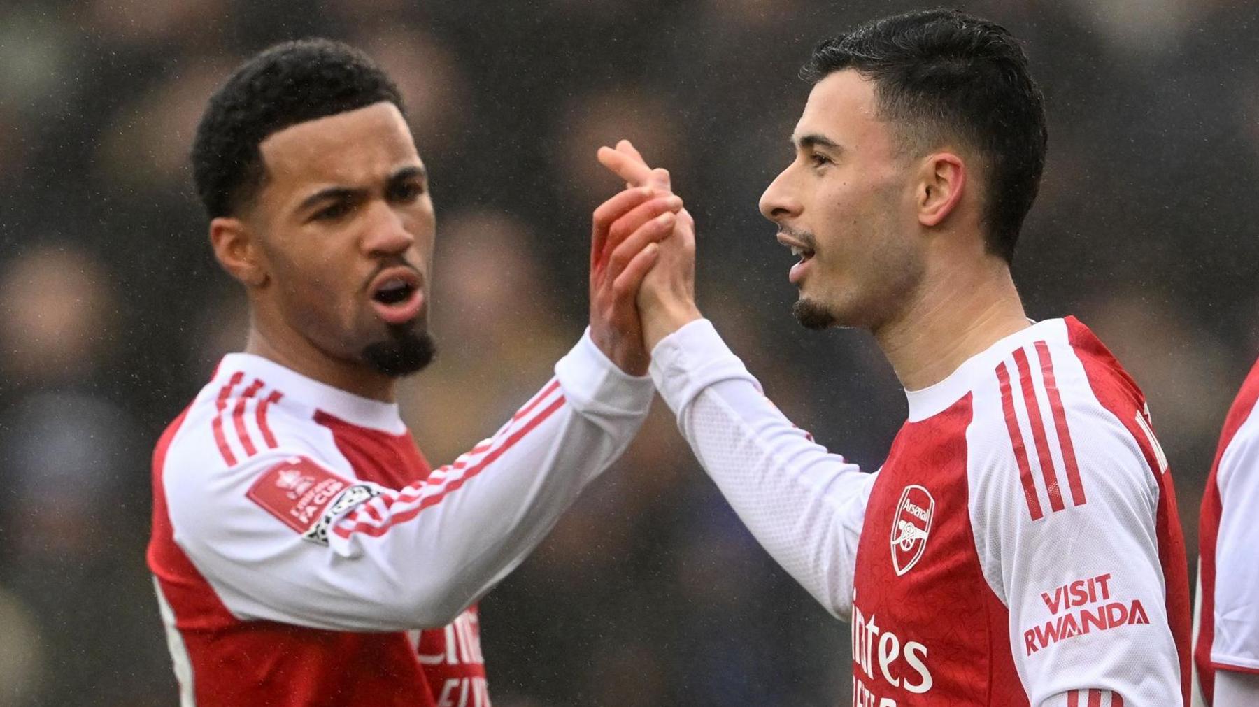 Arsenal forwards Ethan Nwaneri and Gabriel Martinelli high five