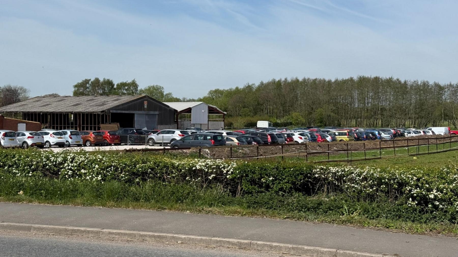 Farm land with over 100 vehicles being stored on the land near Hatton in Derbyshire.