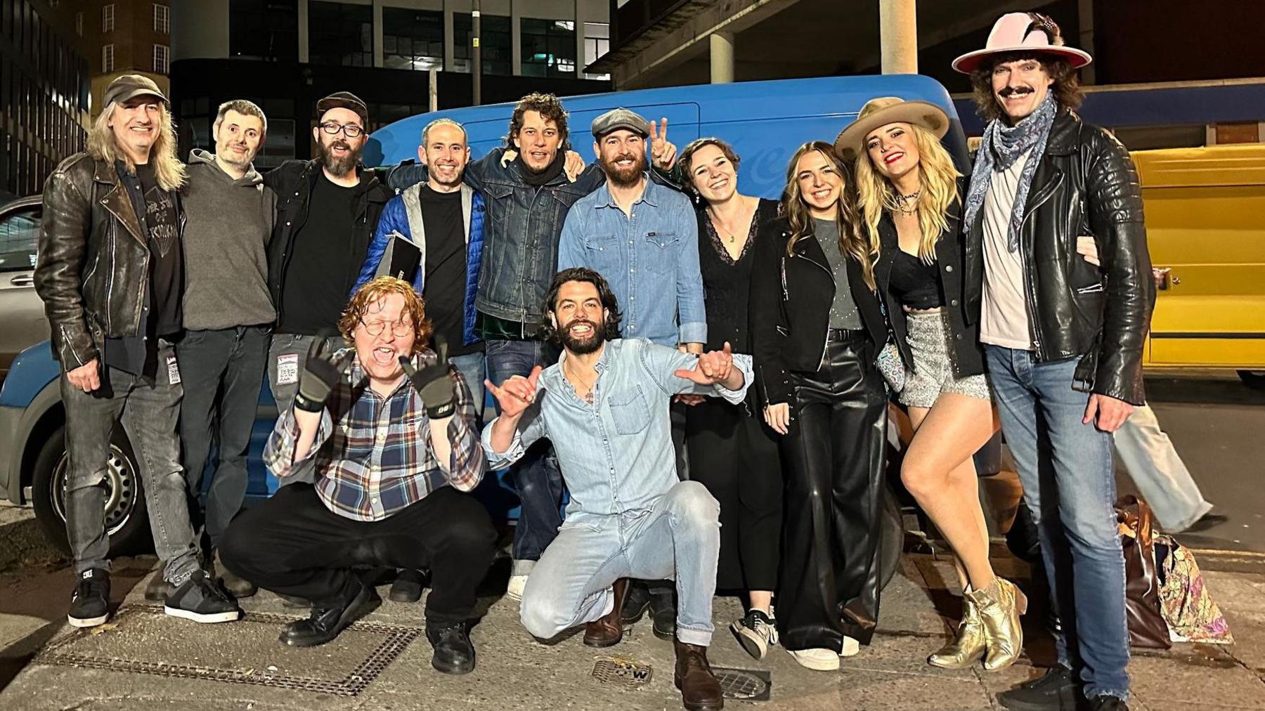 A group of roadies, support staff and musicians pose for the camera after the Elles Bailey concert at SWX in Bristol. The blues musician is pictured second from the right wearing a cowboy-style hat