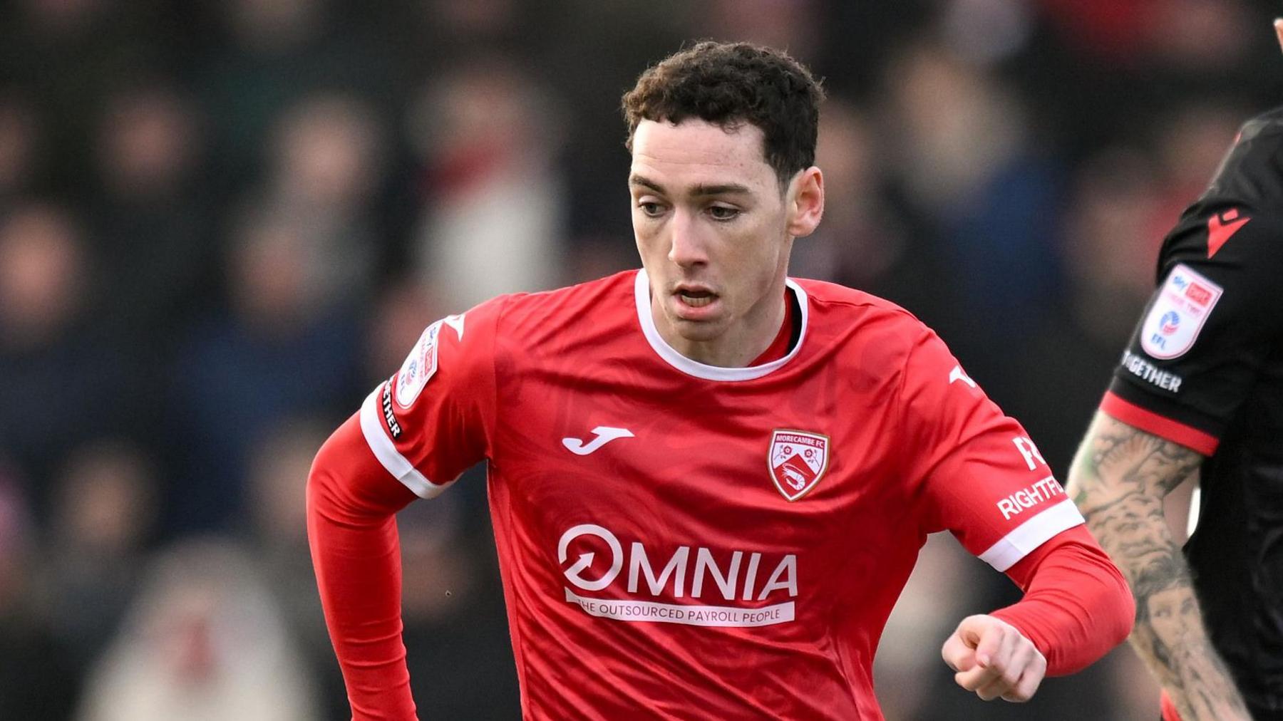 Joe Adams in action for Morecambe