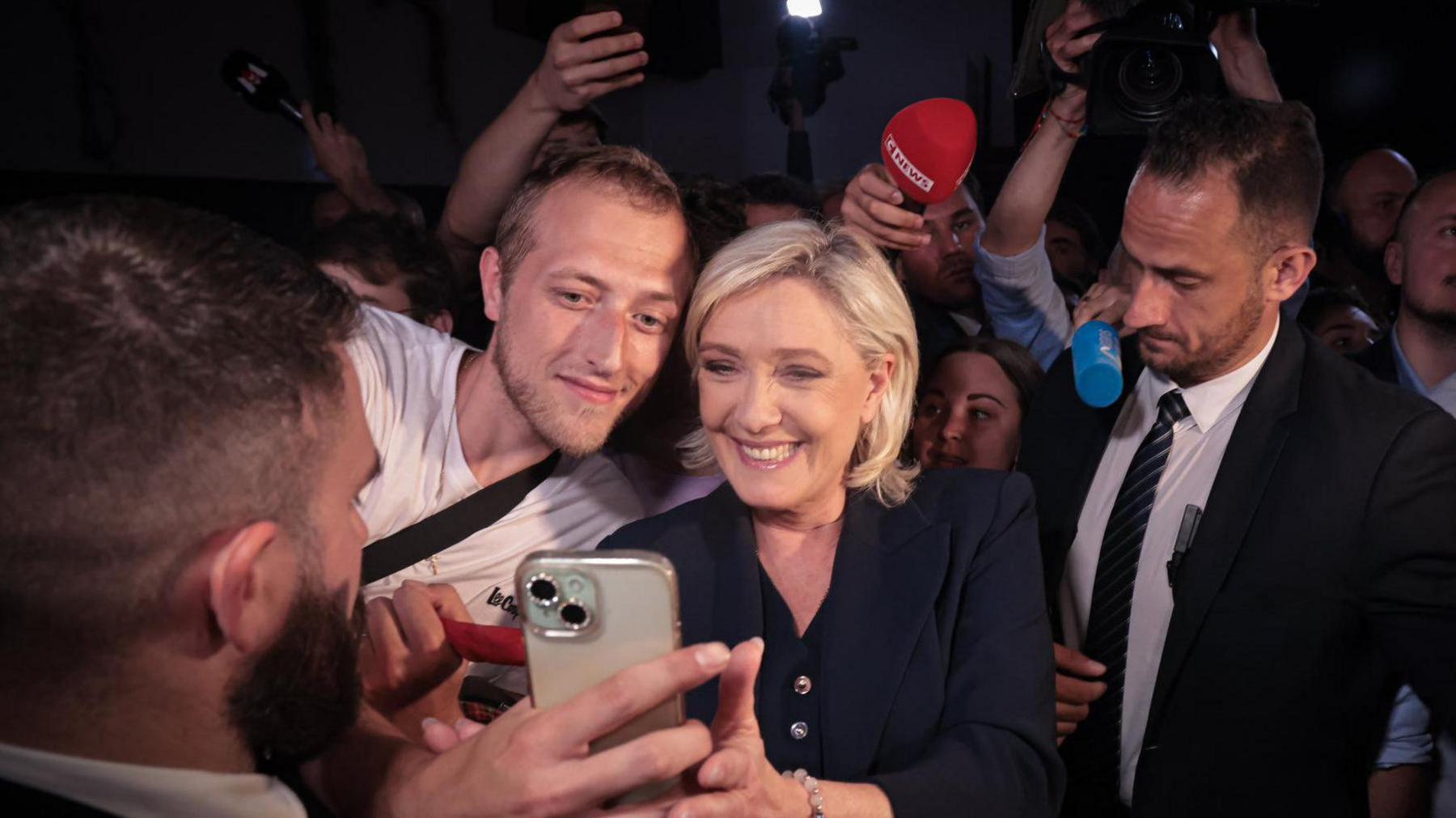 Marine Le Pen (C), the candidate for the National Rally party, with supporters at the end of the French election day in Paris, France.