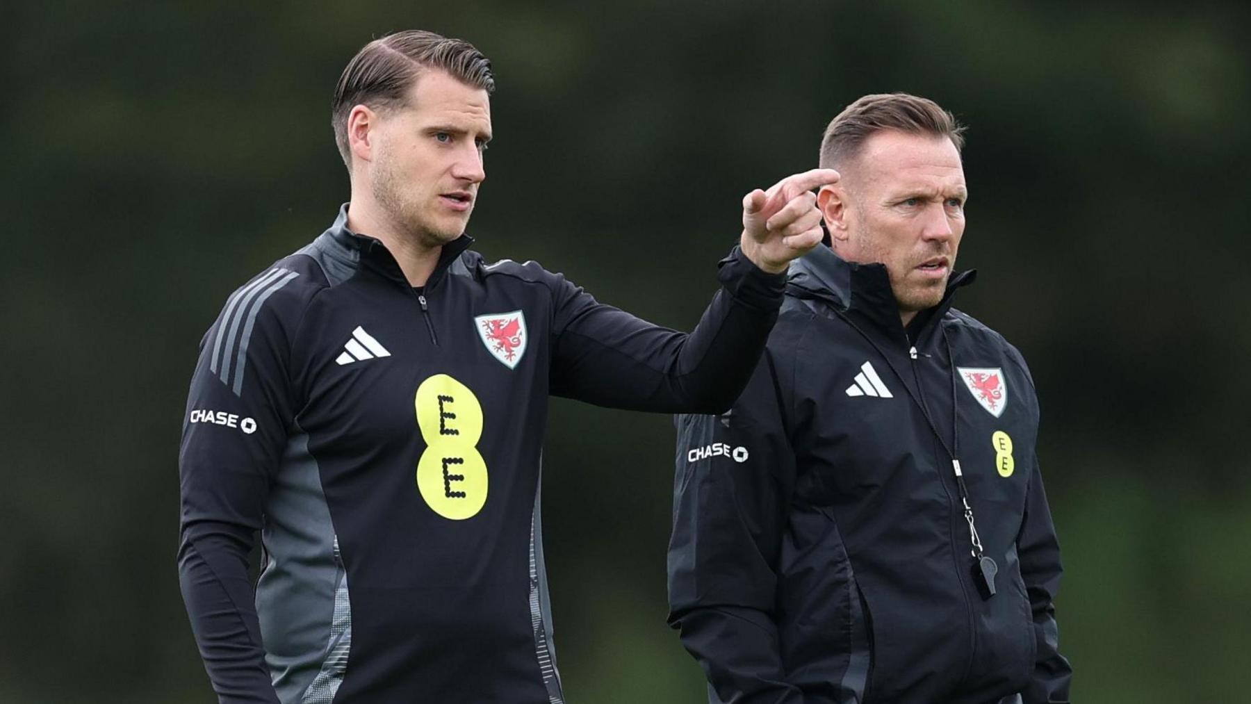 Piet Cremers and Craig Bellamy during a Wales training session