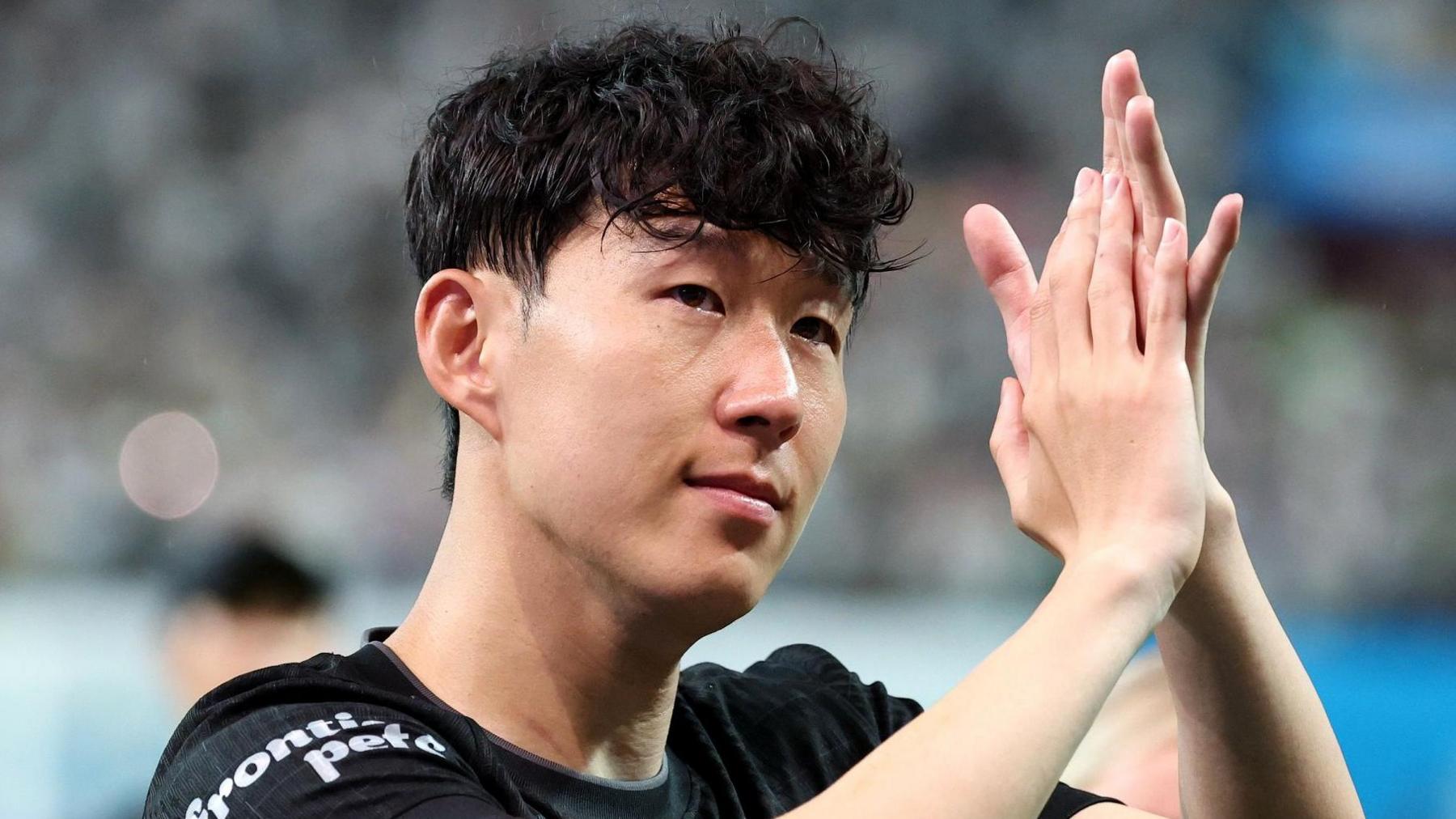 Son Heung-min applauds supporters at Seoul World Cup Stadium after playing his final game for Tottenham